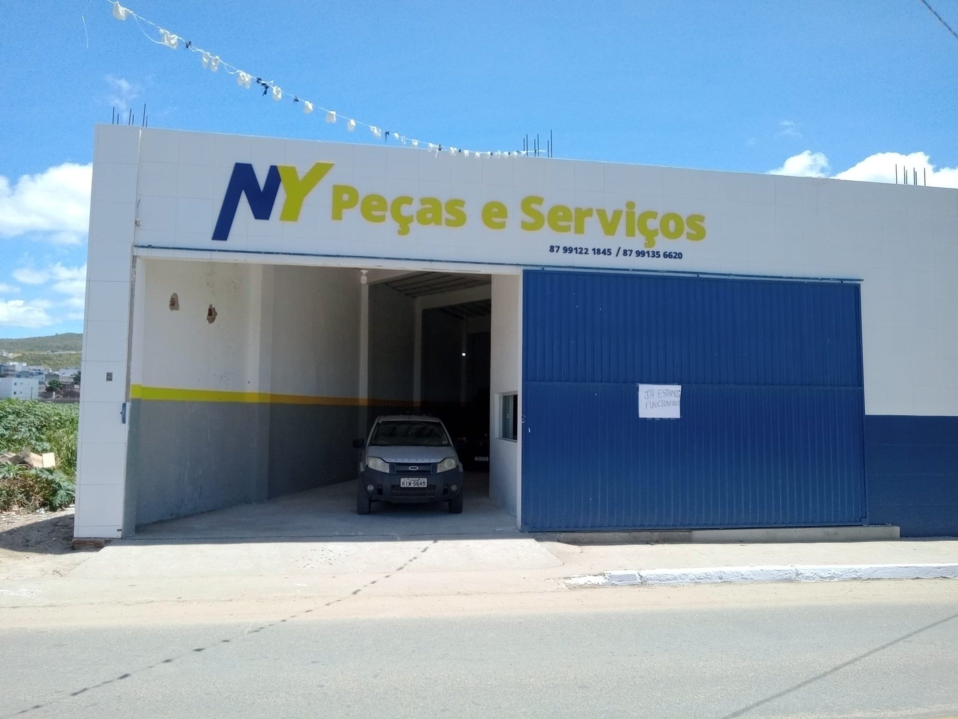 woman wearing yellow long-sleeved dress under white clouds and blue sky during daytime