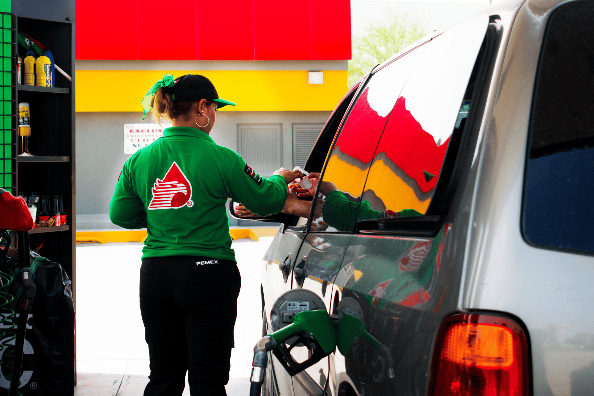 an abstract photo of a curved building with a blue sky in the background