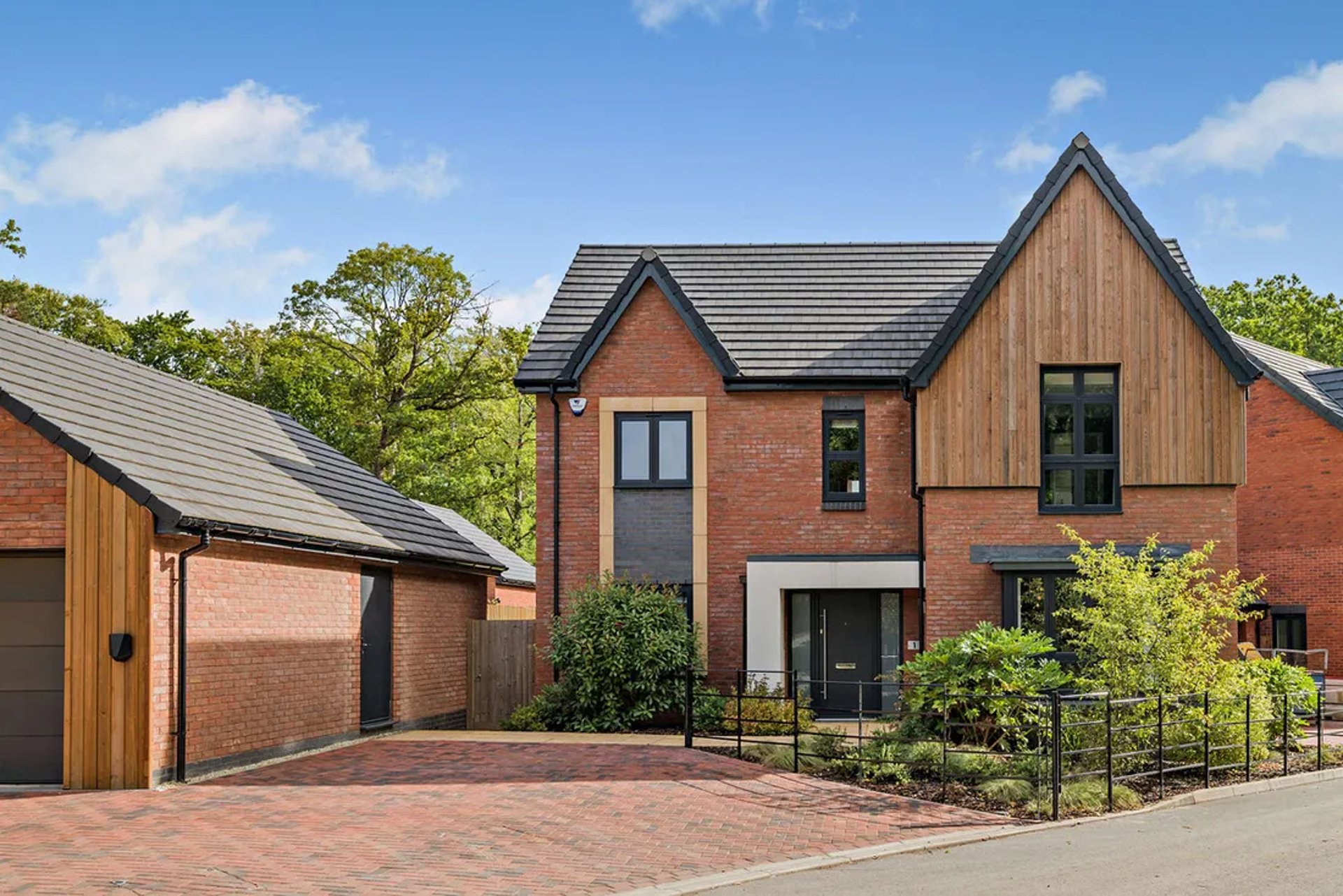 black and brown leather padded tub sofa