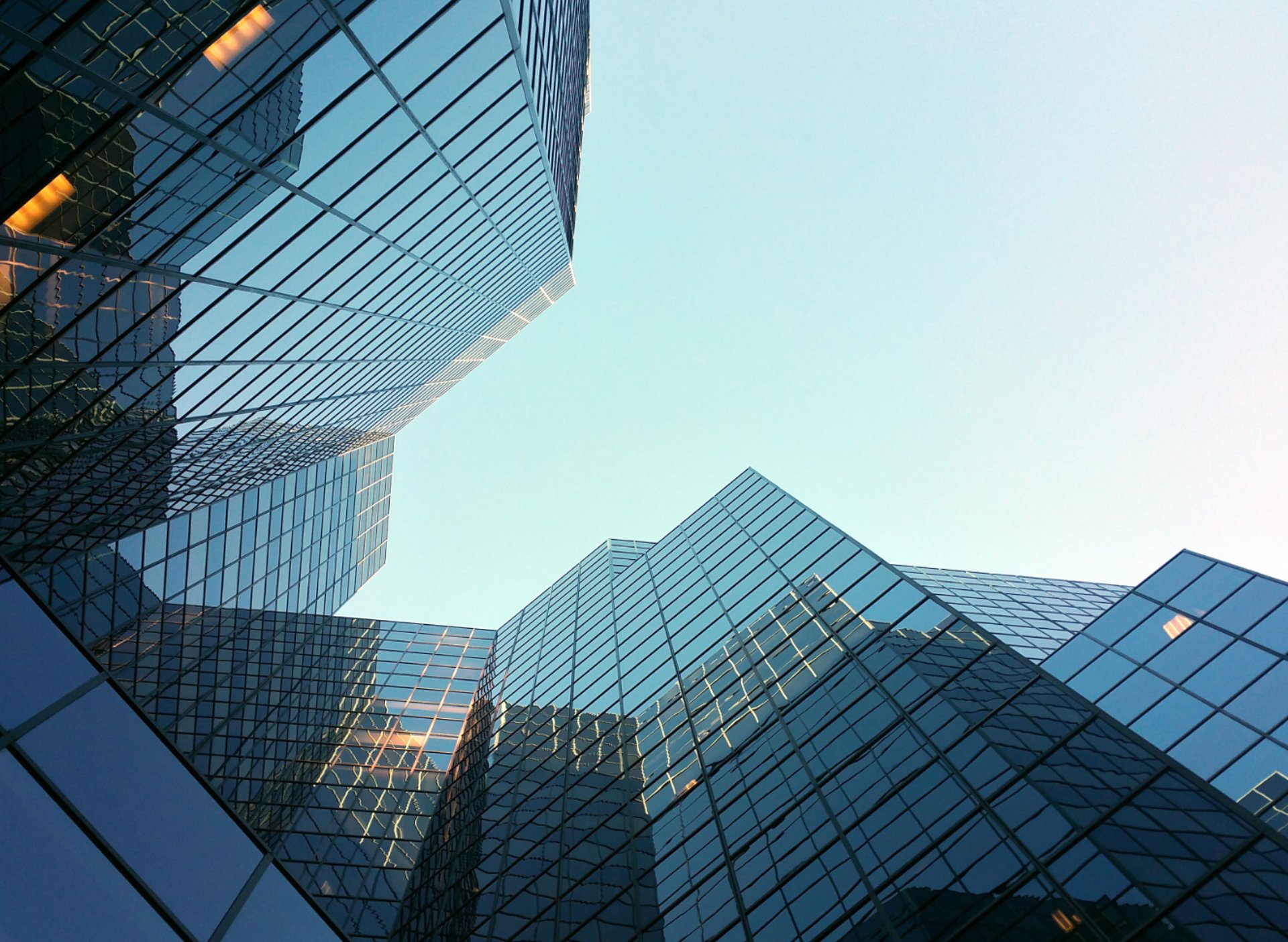 woman wearing yellow long-sleeved dress under white clouds and blue sky during daytime