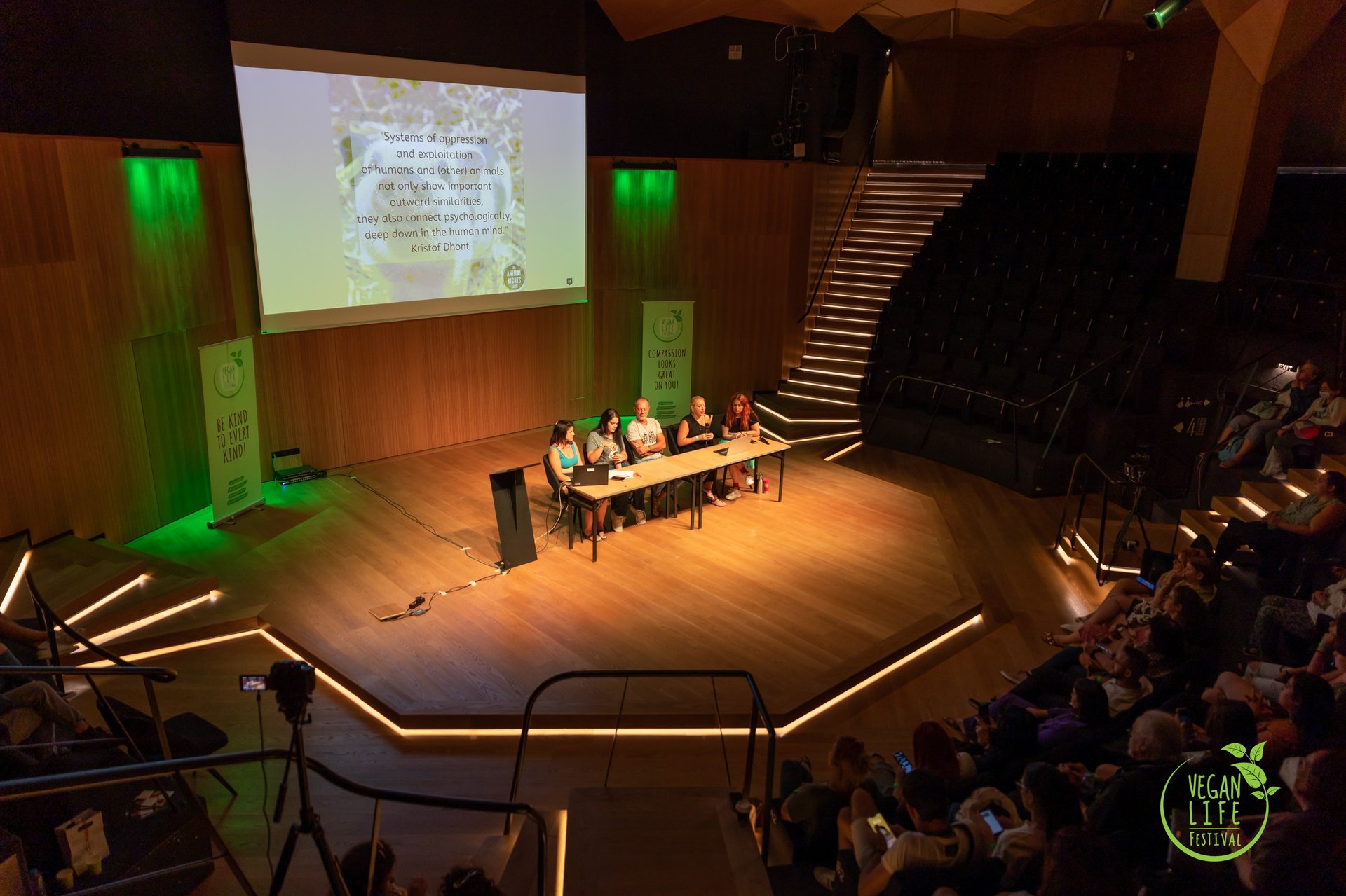 an abstract photo of a curved building with a blue sky in the background