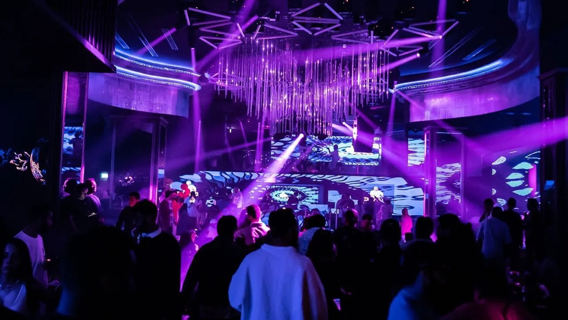 an abstract photo of a curved building with a blue sky in the background