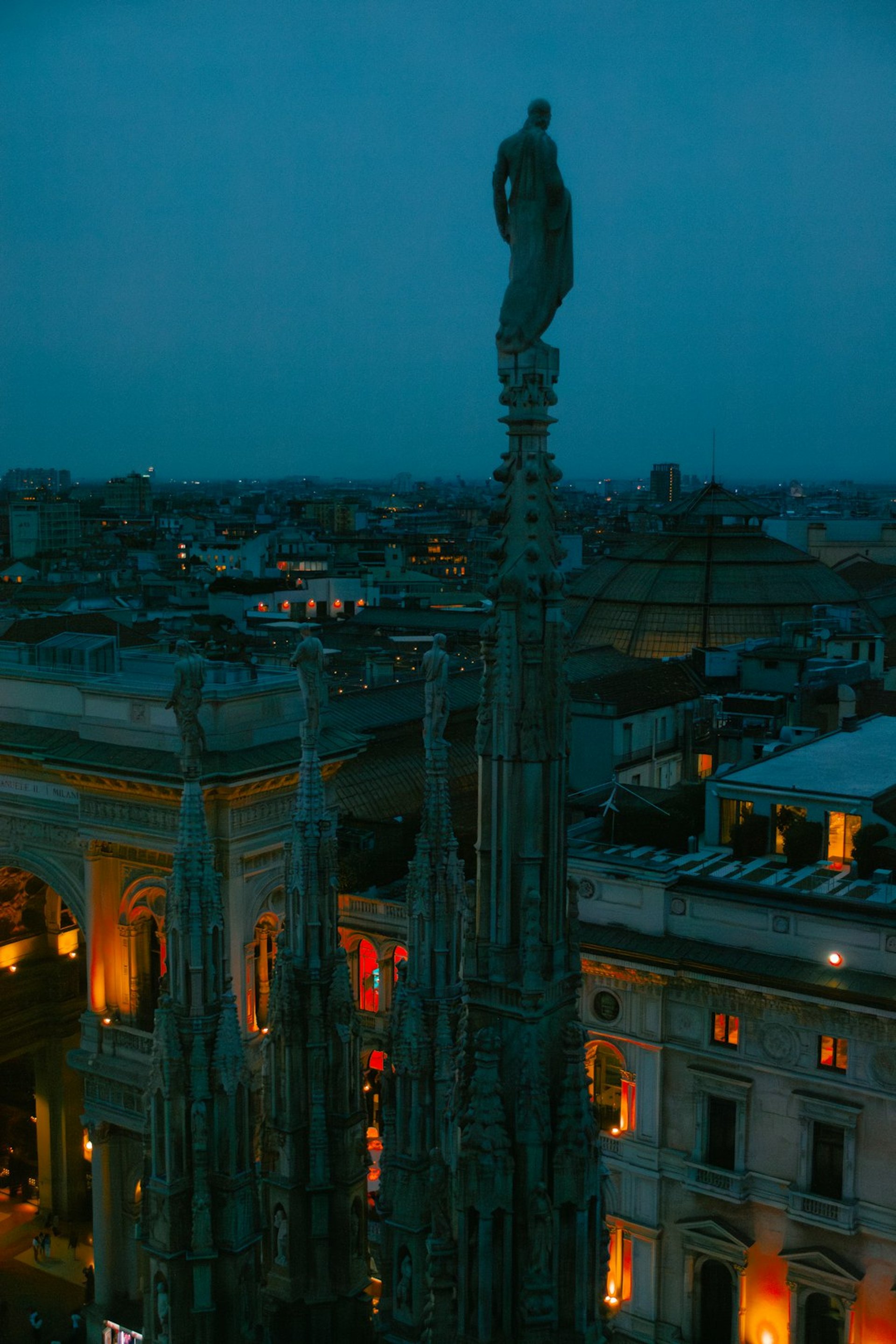 A tall building with a statue on top of it