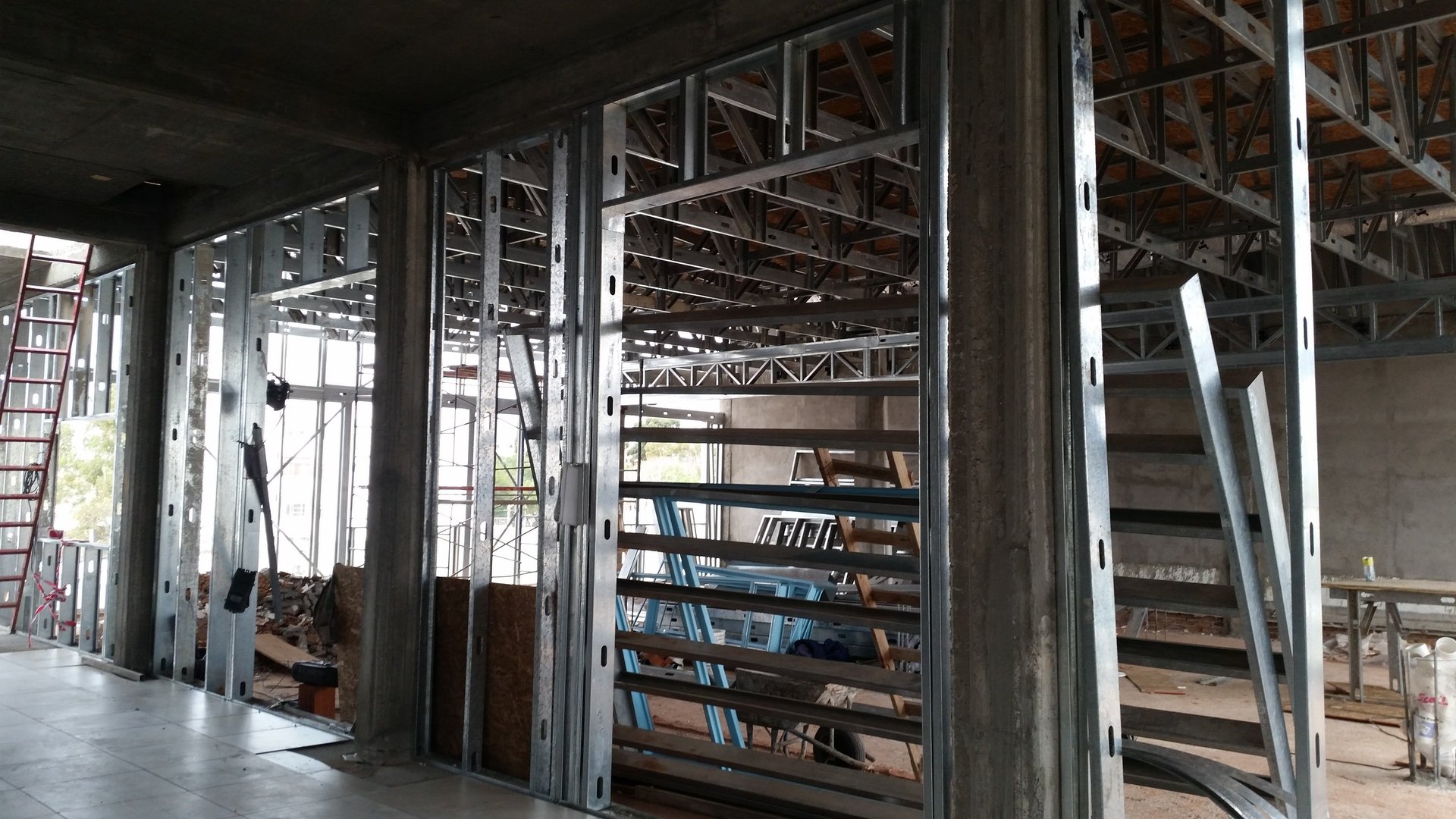 an abstract photo of a curved building with a blue sky in the background