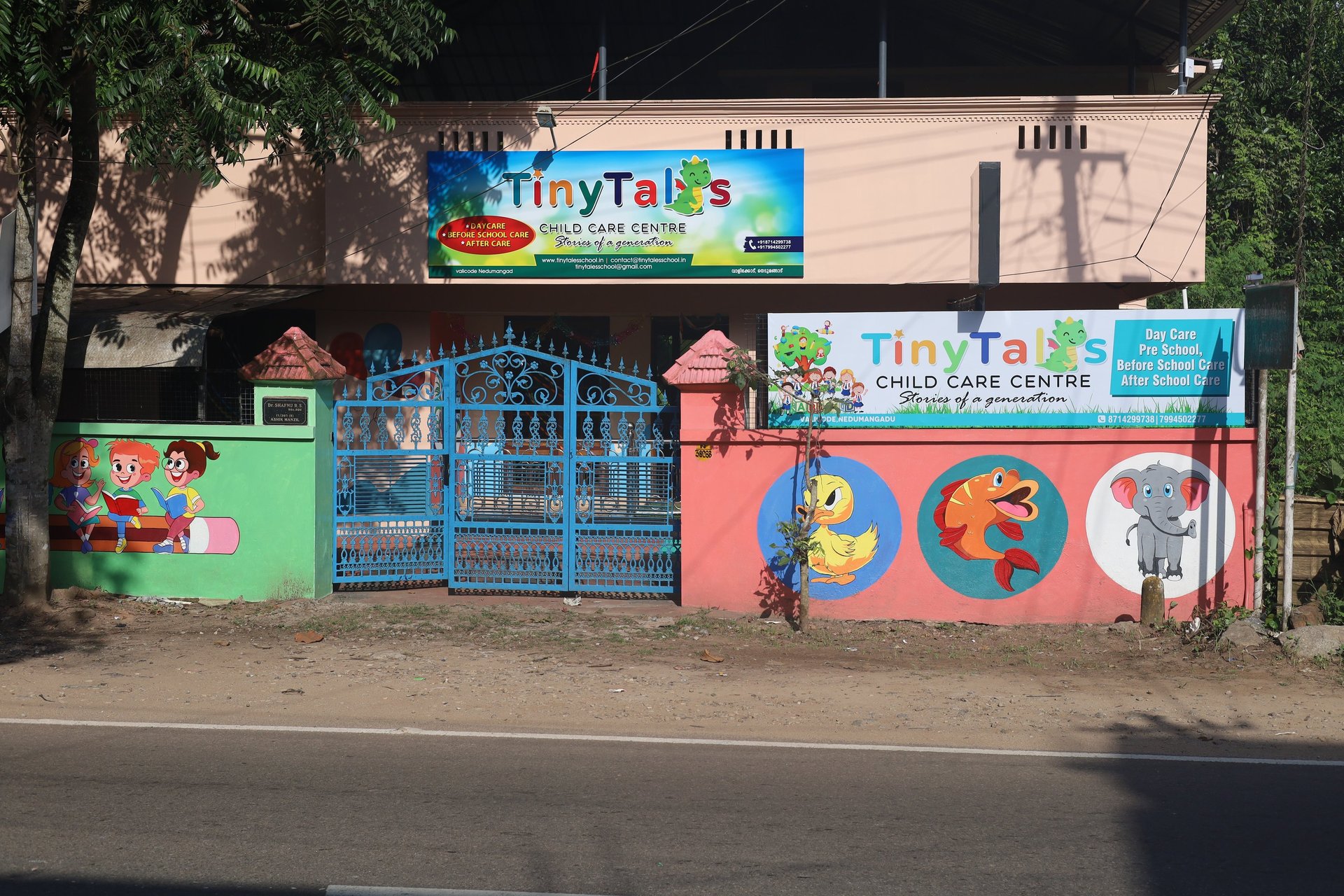assorted paints in brown wooden trays on table
