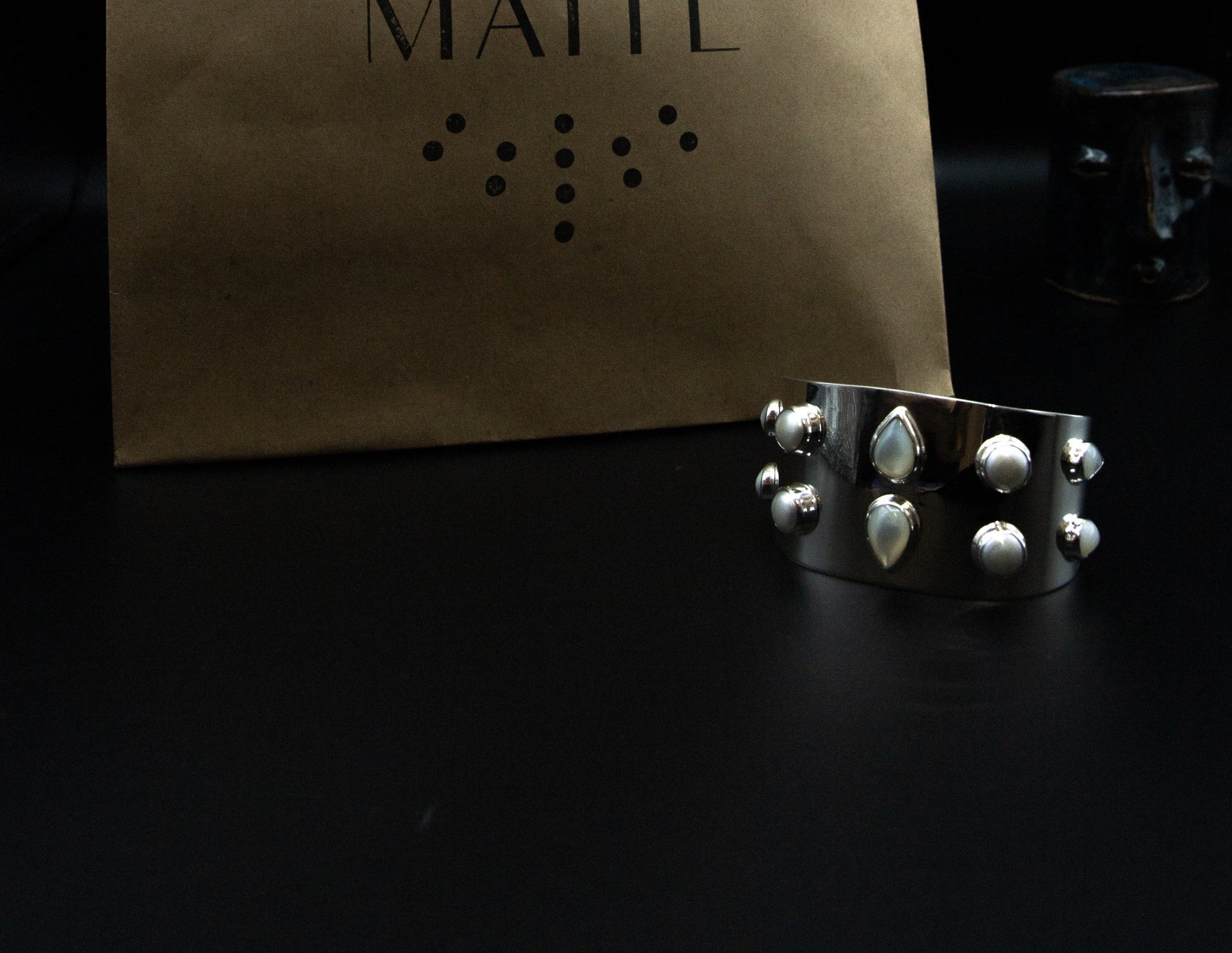 an abstract photo of a curved building with a blue sky in the background