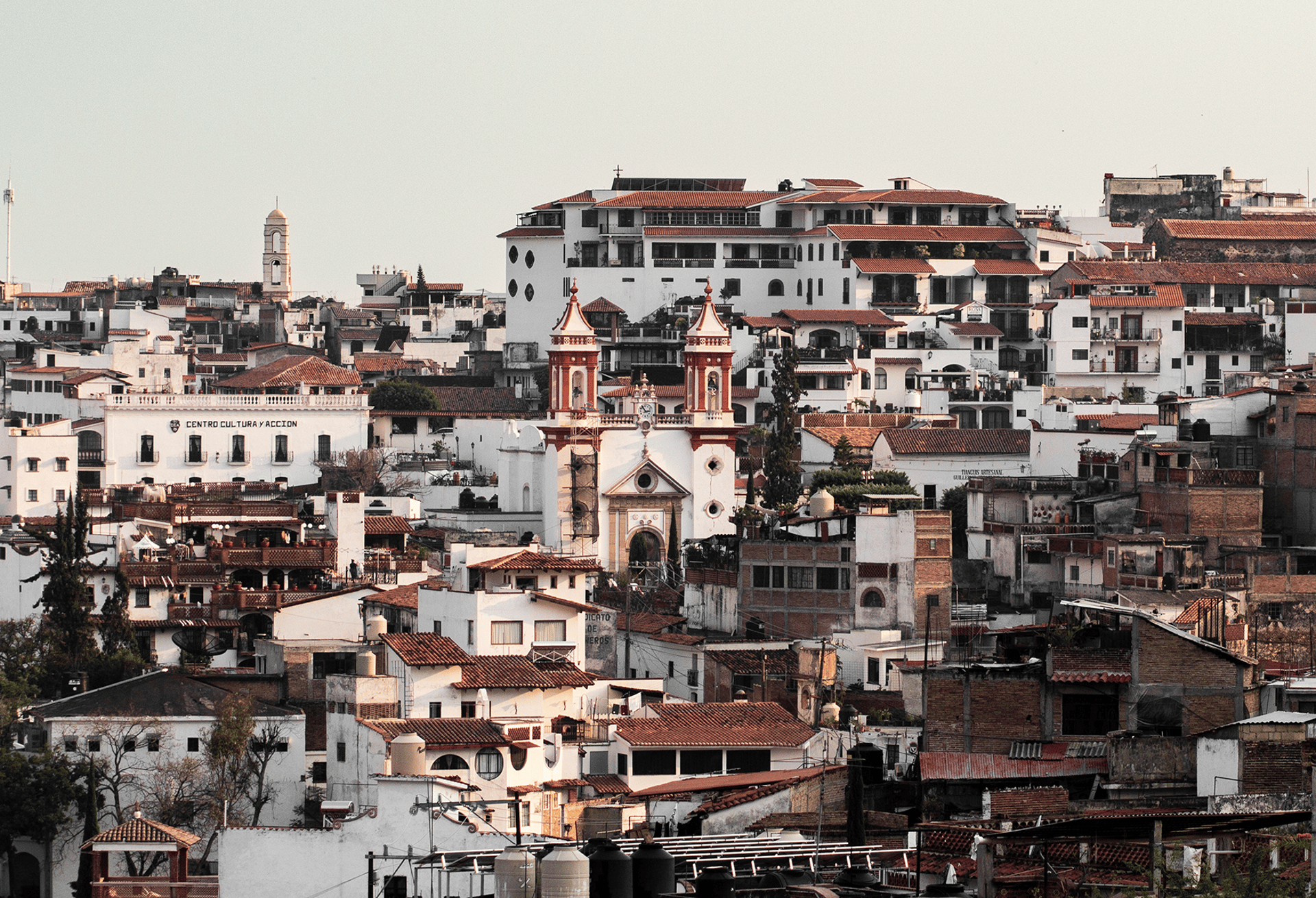 an abstract photo of a curved building with a blue sky in the background