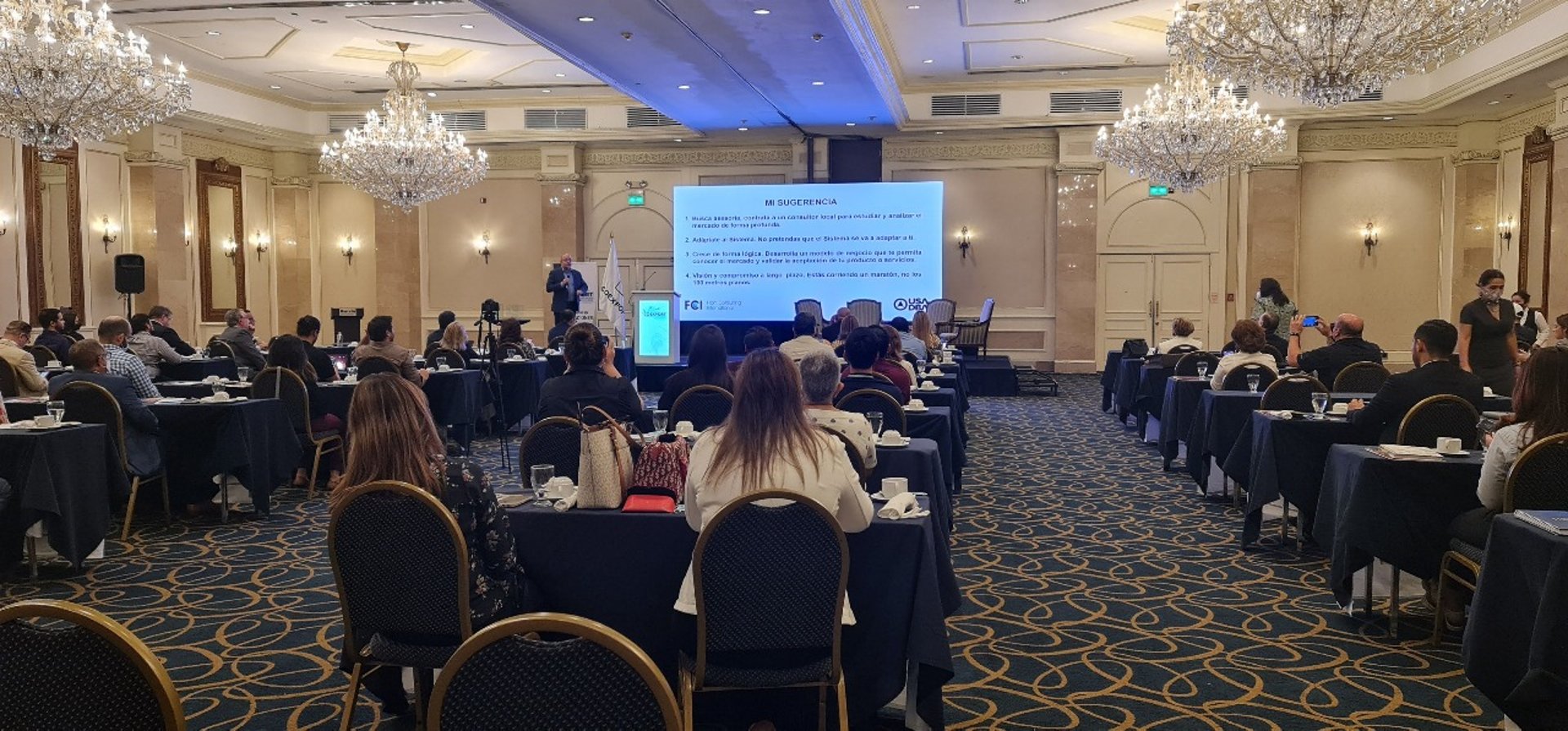 an abstract photo of a curved building with a blue sky in the background
