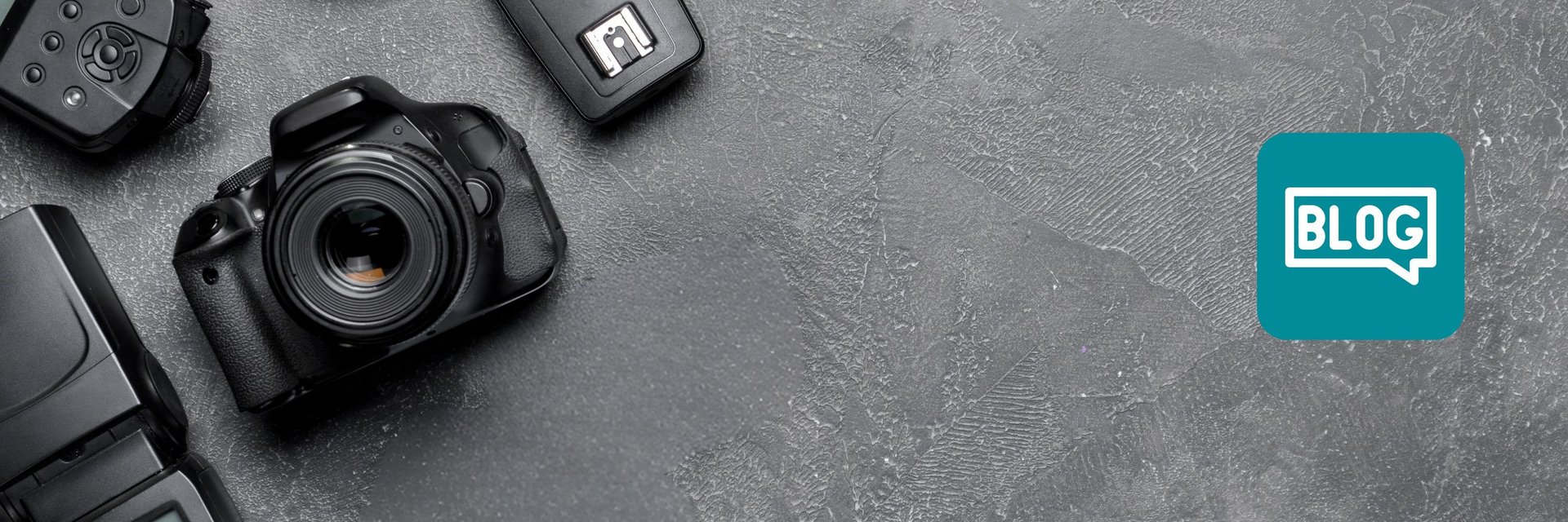DSLR camera and photography gear on dark textured background with blog icon