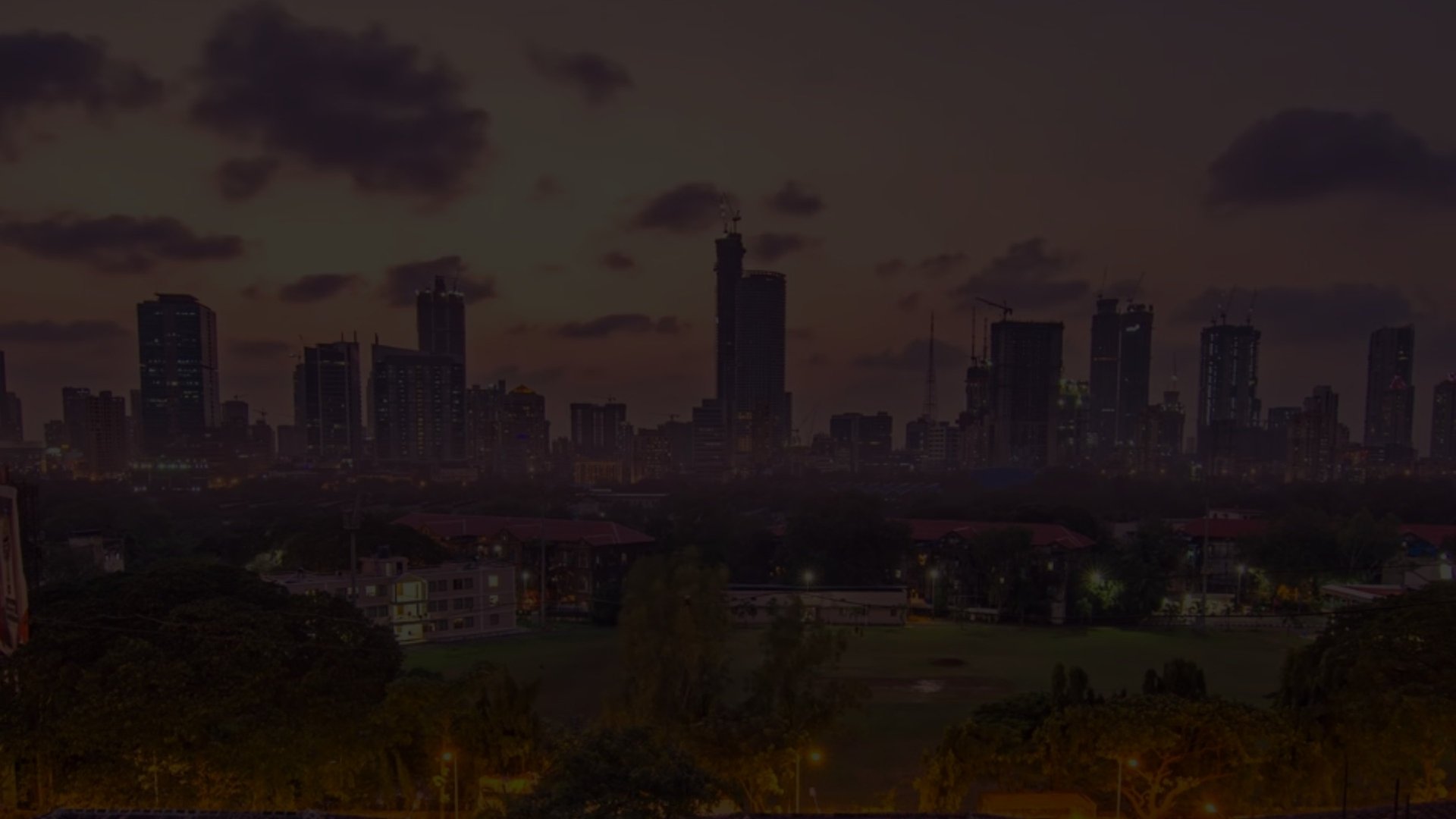 an abstract photo of a curved building with a blue sky in the background
