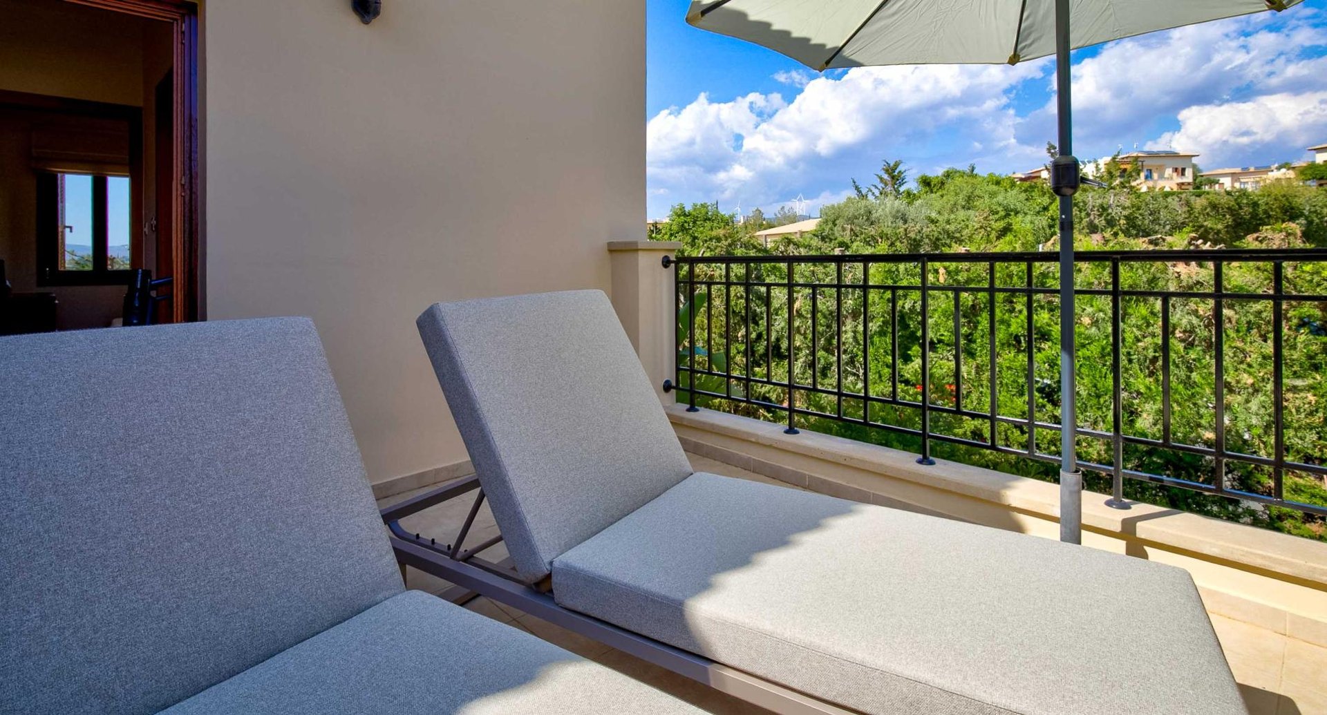 Sunrise terrace with sunbeds at Theseus Retreat holiday rental in Aphrodite Hills Resort, Cyprus