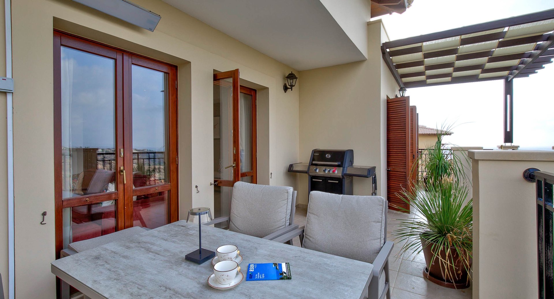 Terrace lounge area with infrared heater, high-end gas barbecue and panoramic sea view