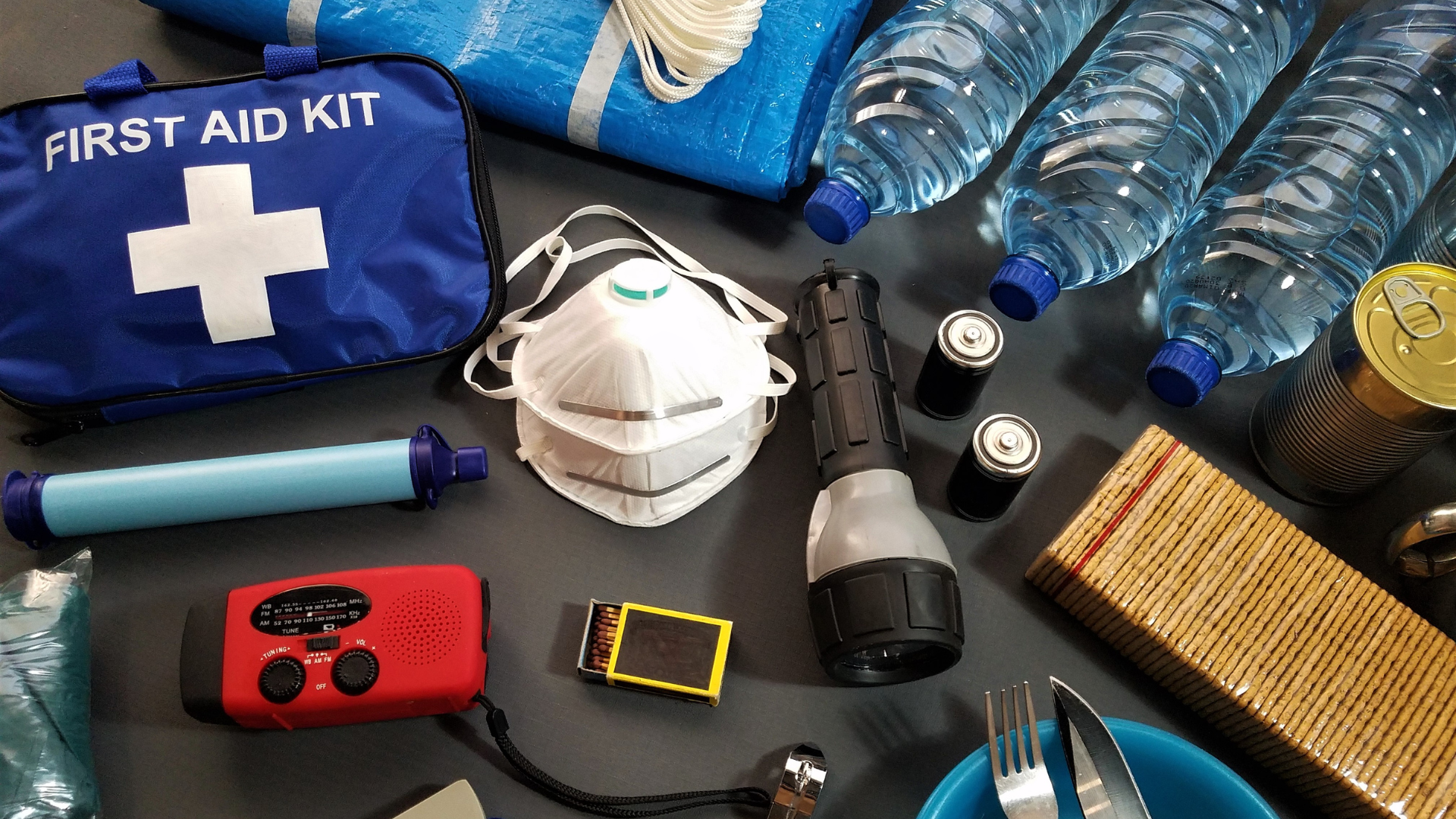 orange dome tent surrounded by silhouette of trees at blue hour