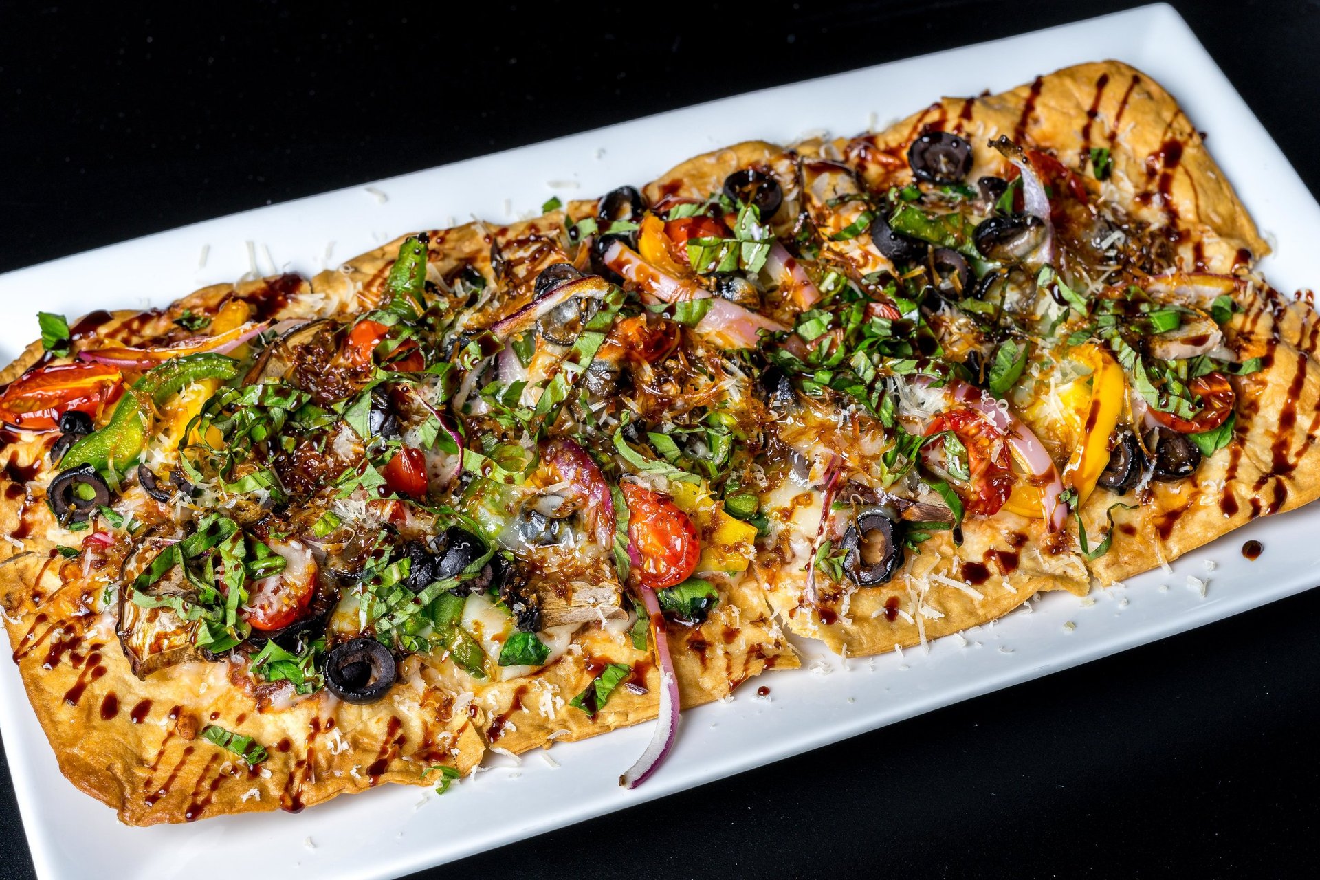 an abstract photo of a curved building with a blue sky in the background