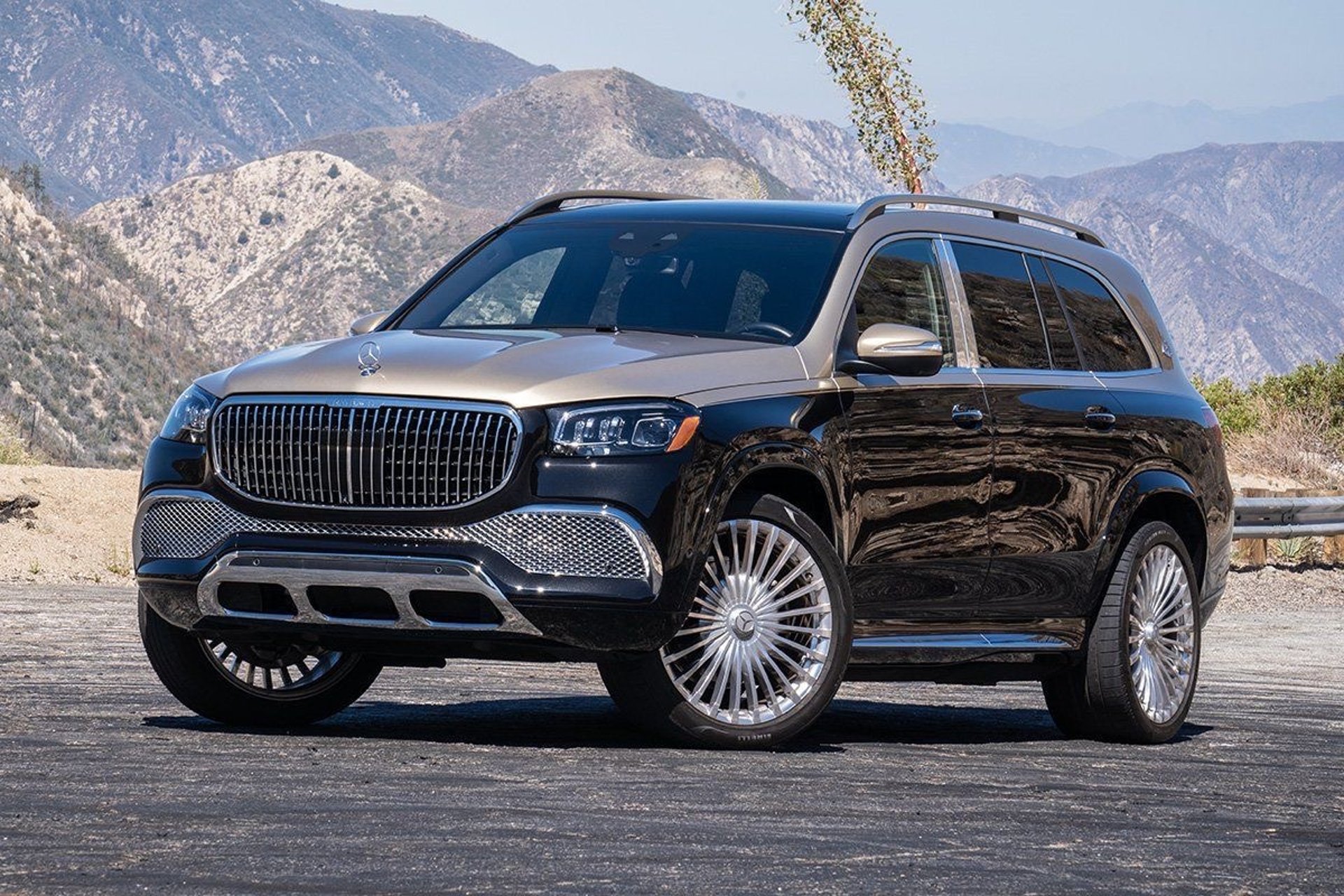 blue suv on brown dirt road during daytime