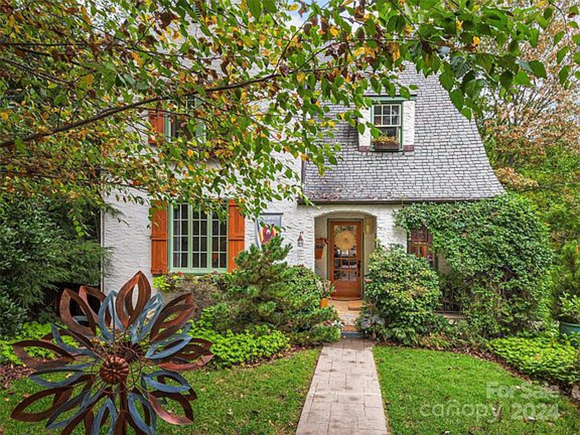 black and brown leather padded tub sofa