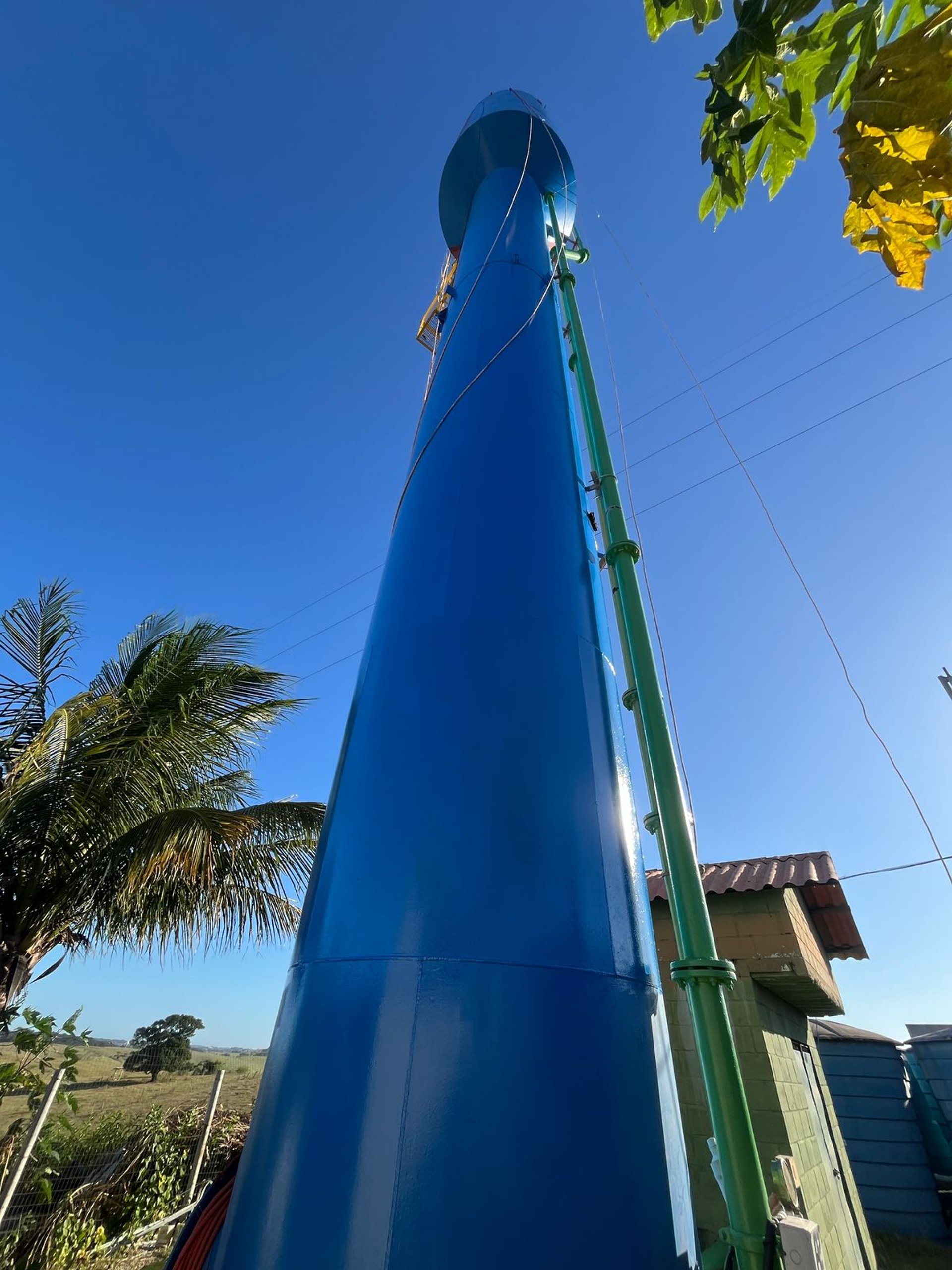 an abstract photo of a curved building with a blue sky in the background