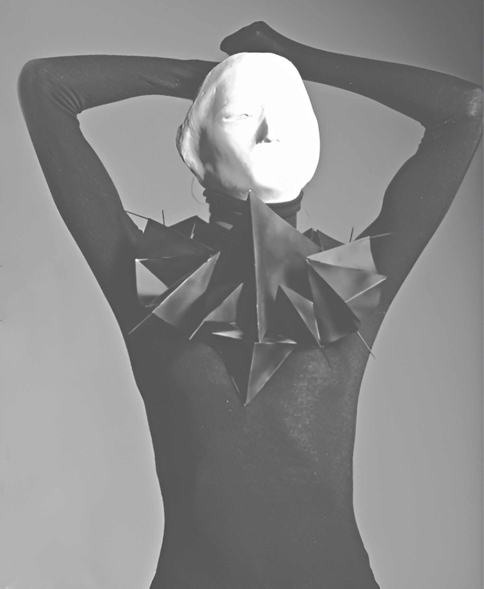 Elizabeth Lotz (Liz Lotz) art director fashion storyteller artist portrait with paper art mask and conceptual prop design
