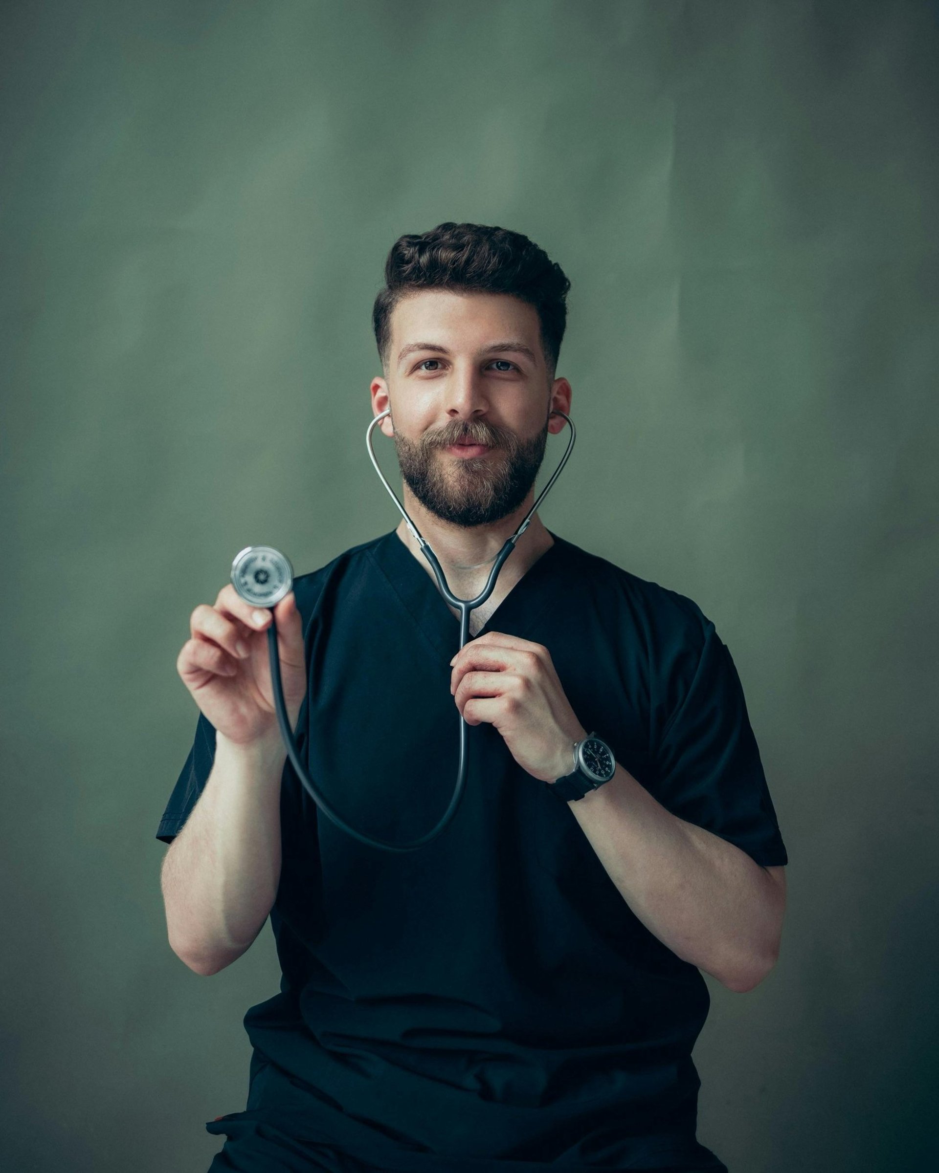 a male doctor in a white coat and tie