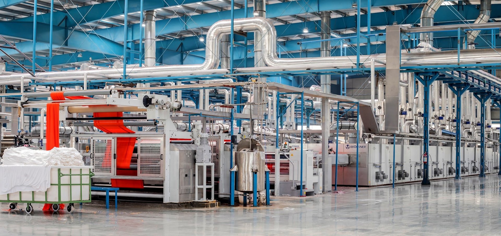 an abstract photo of a curved building with a blue sky in the background