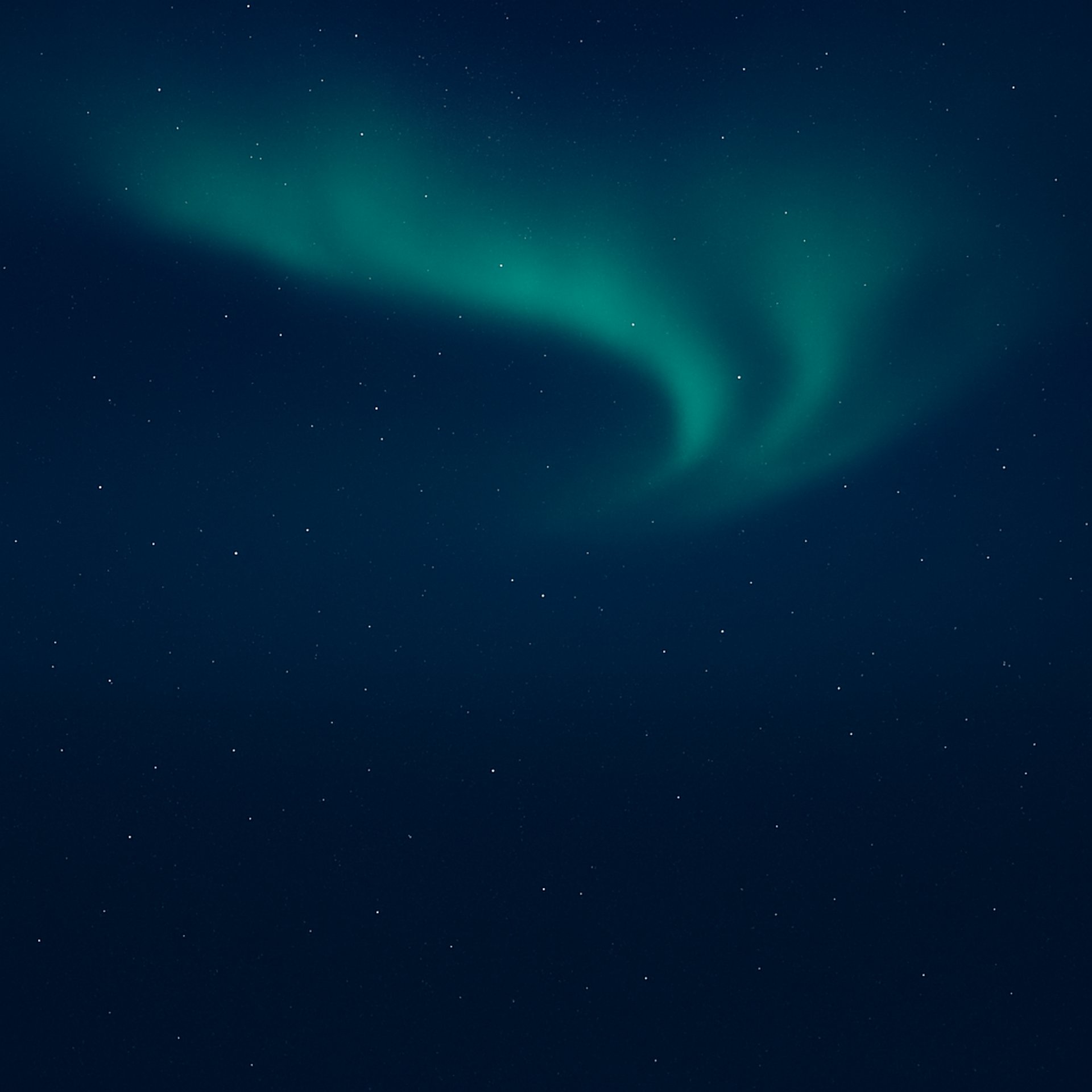 an abstract photo of a curved building with a blue sky in the background