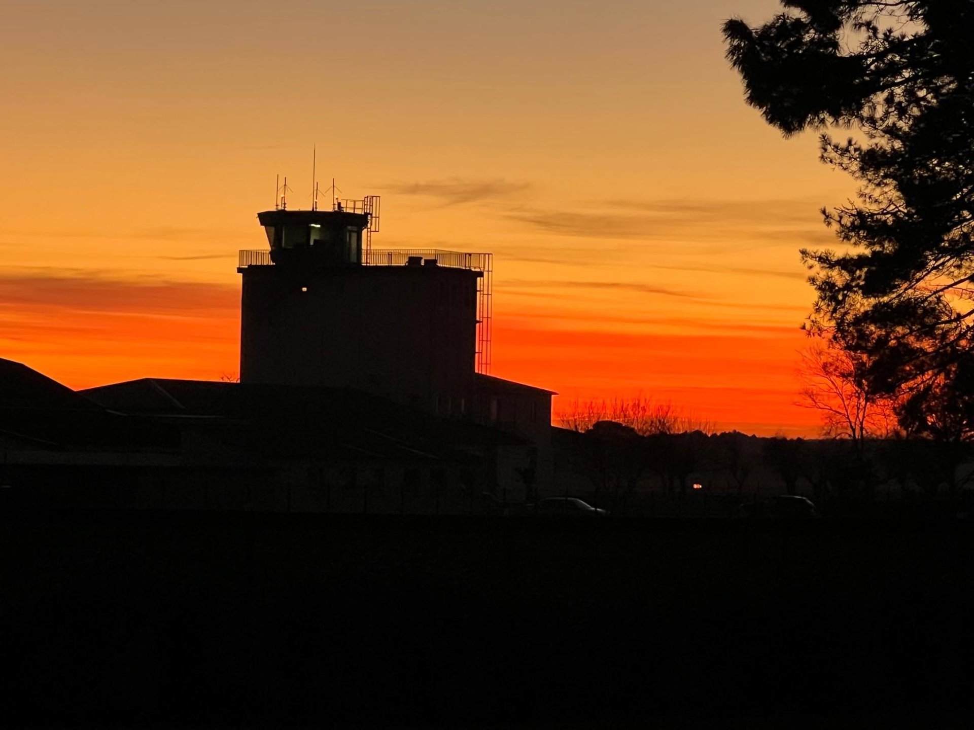 black and brown rotary phone near gray wall