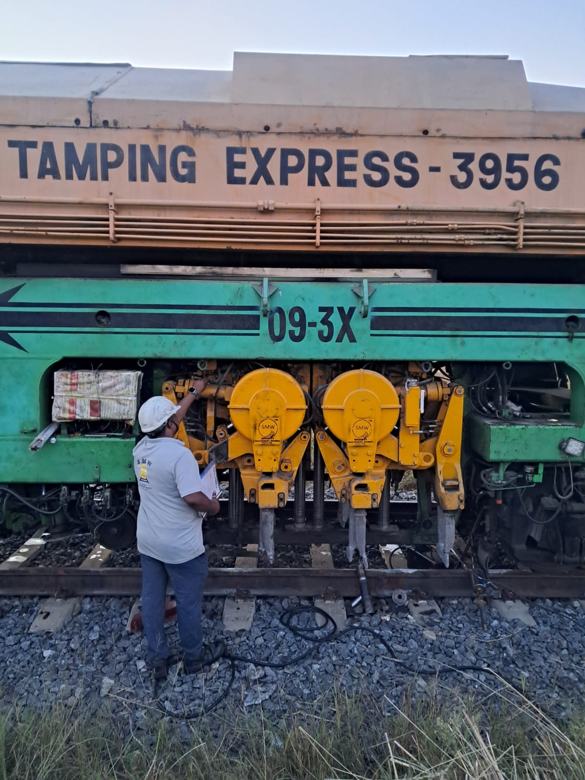 railway between tall trees