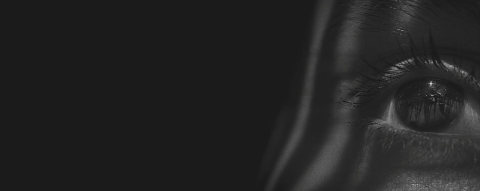 an abstract photo of a curved building with a blue sky in the background