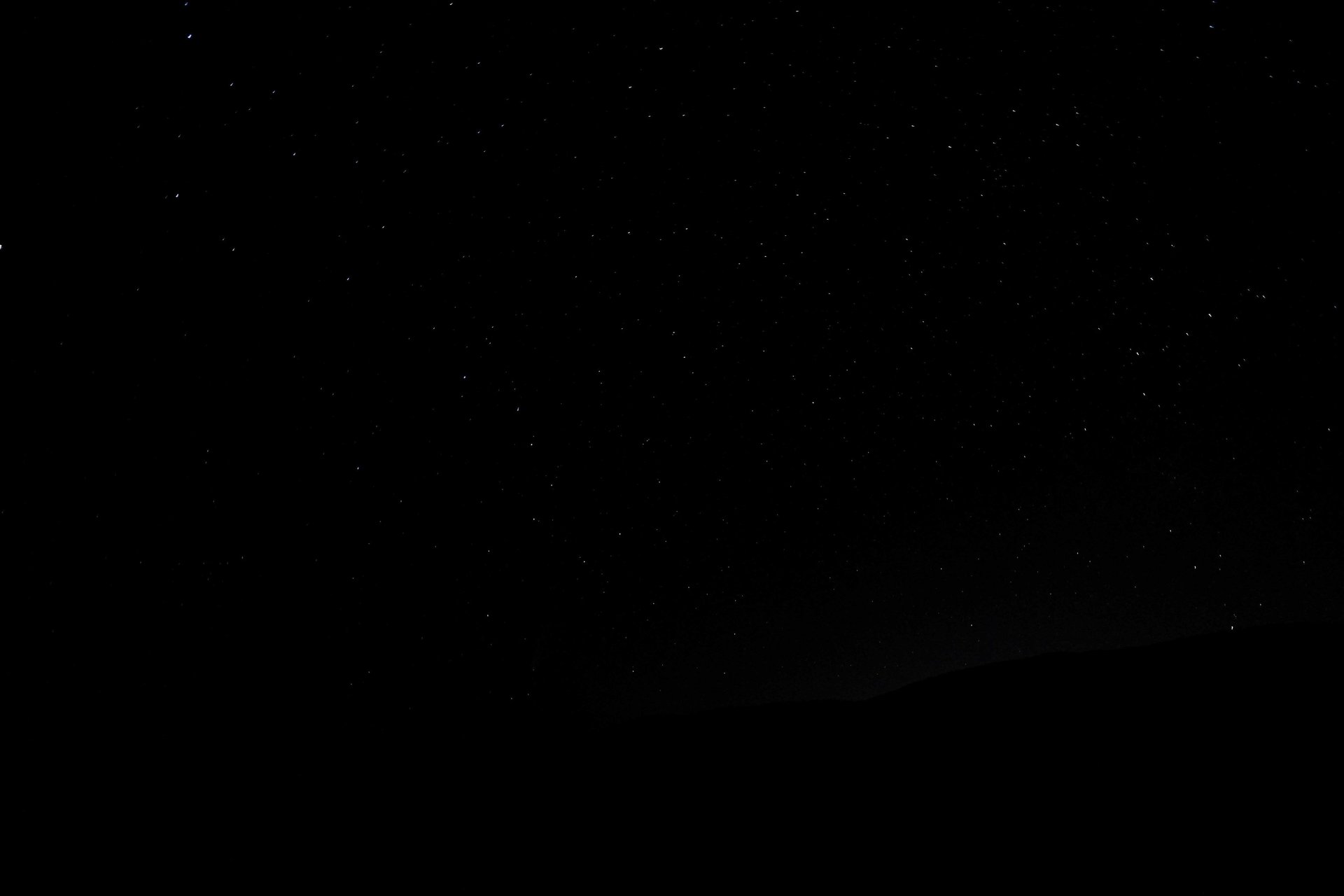 silhouette photo of mountain during night time