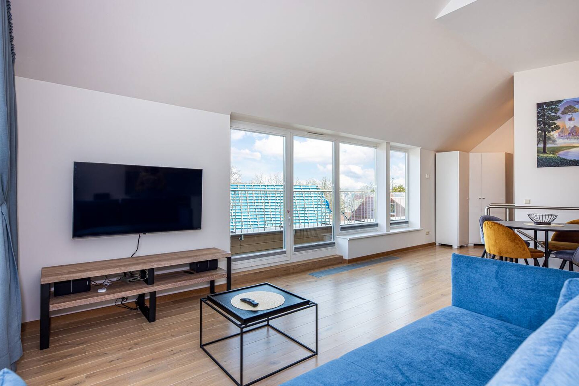 an abstract photo of a curved building with a blue sky in the background