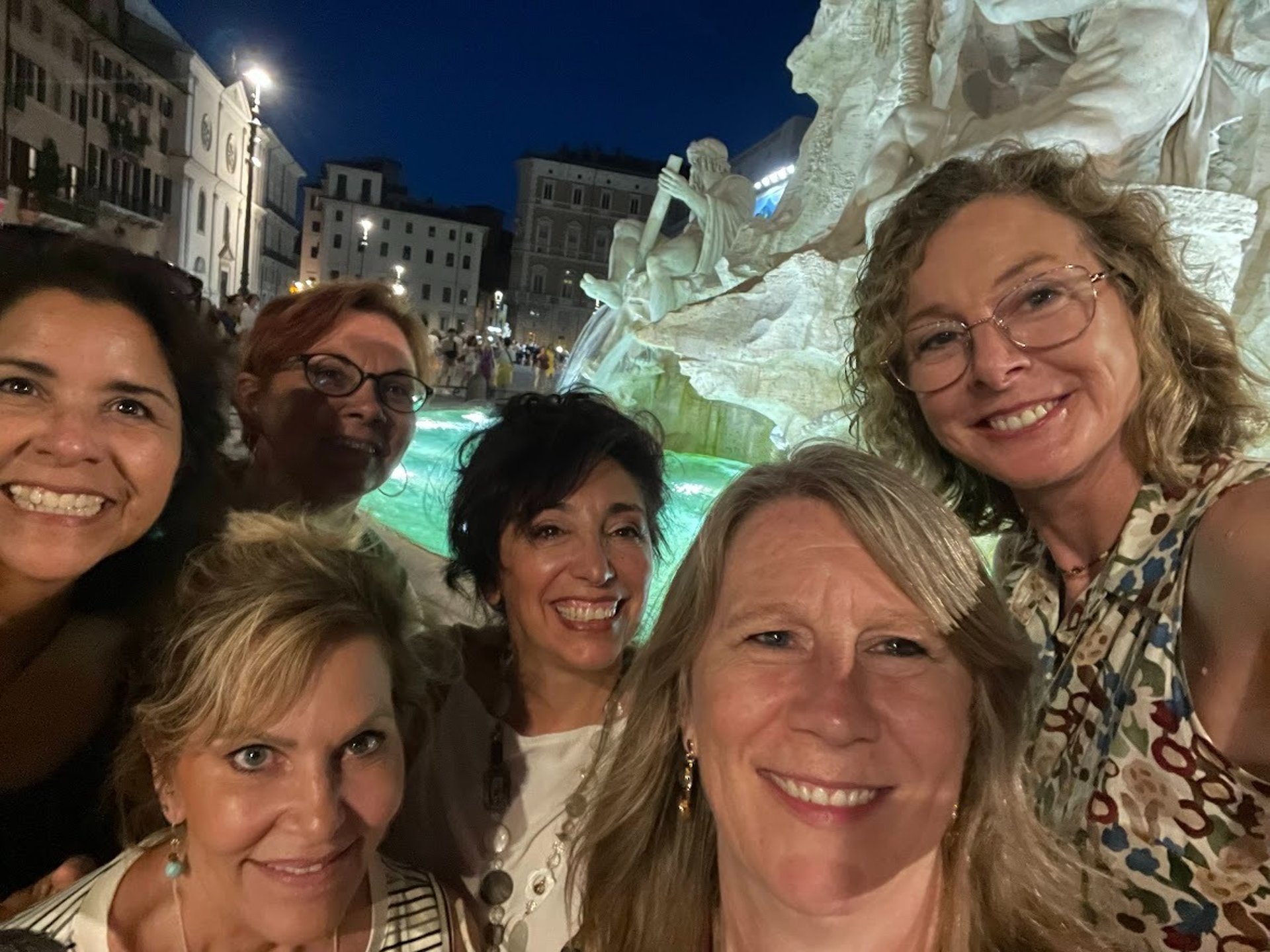 man in black jacket and blue denim jeans sitting on blue and brown inflatable pool