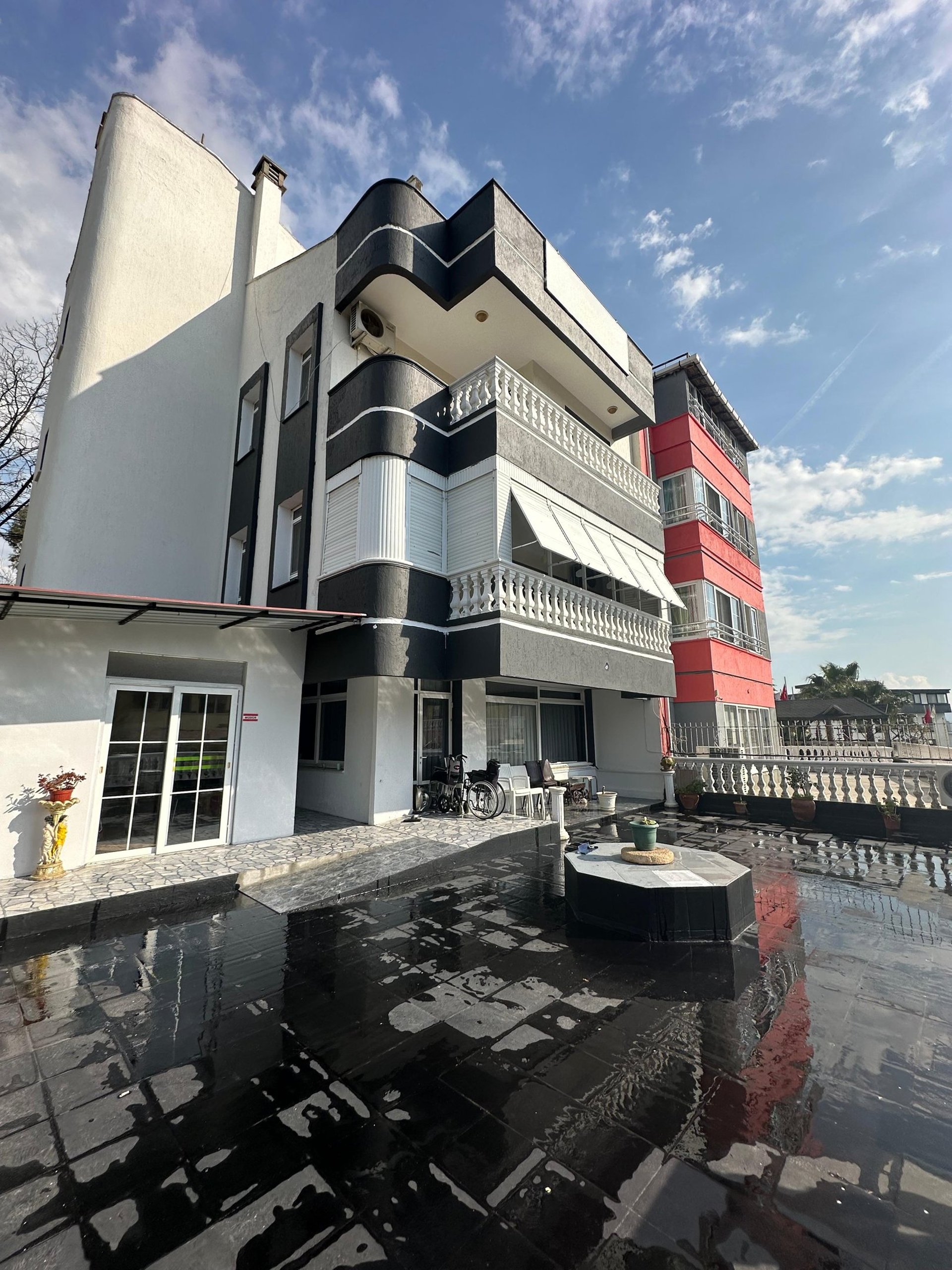 an abstract photo of a curved building with a blue sky in the background