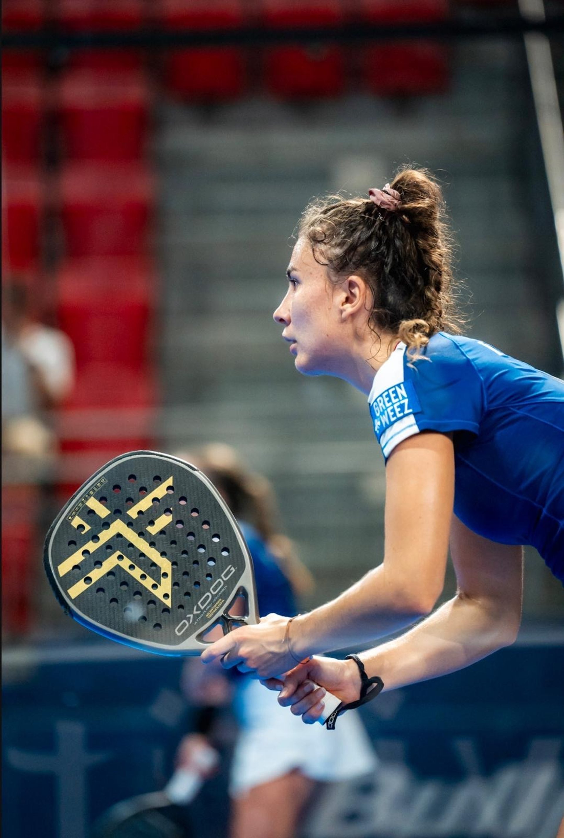 an abstract photo of a curved building with a blue sky in the background