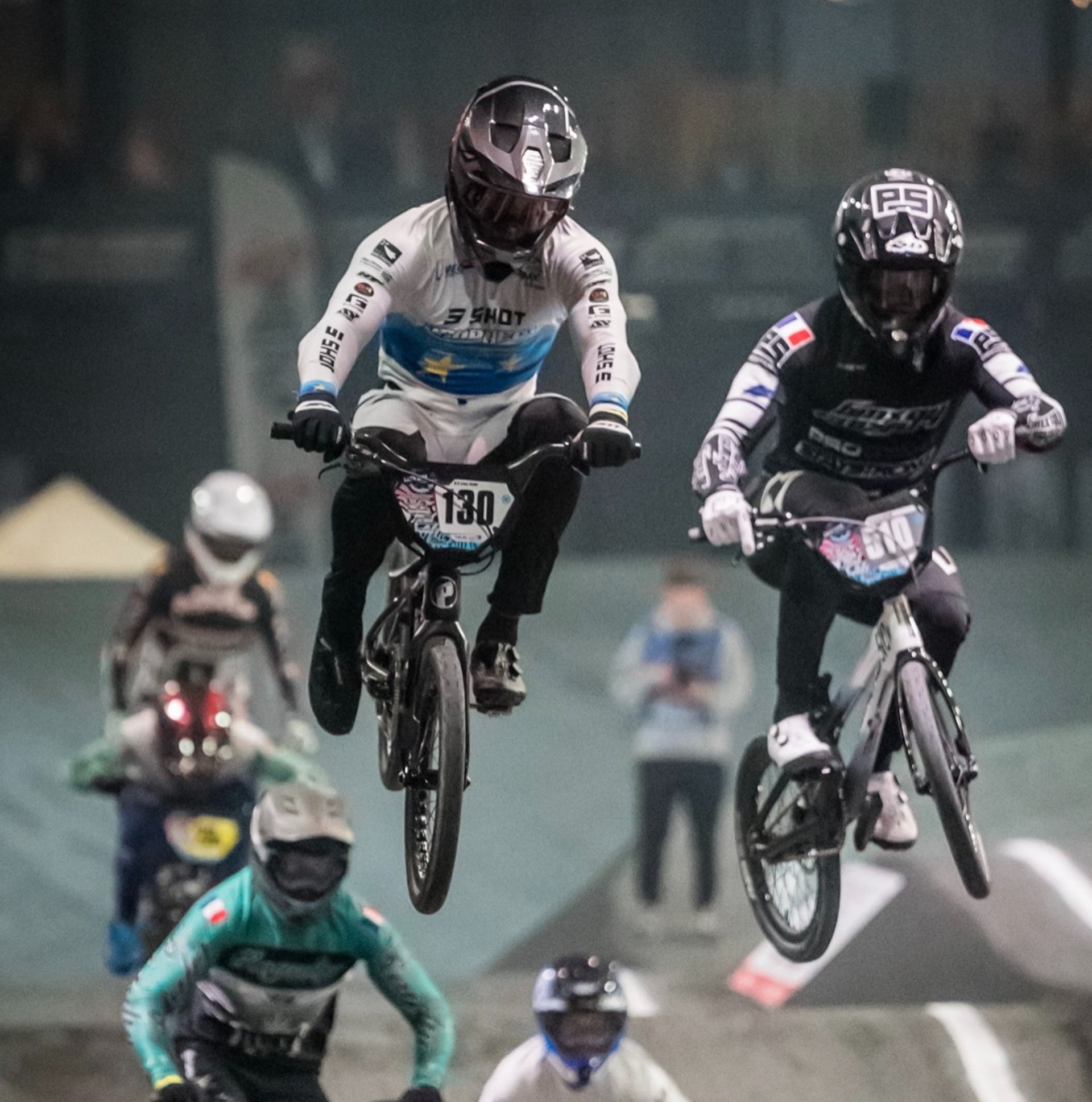 an abstract photo of a curved building with a blue sky in the background