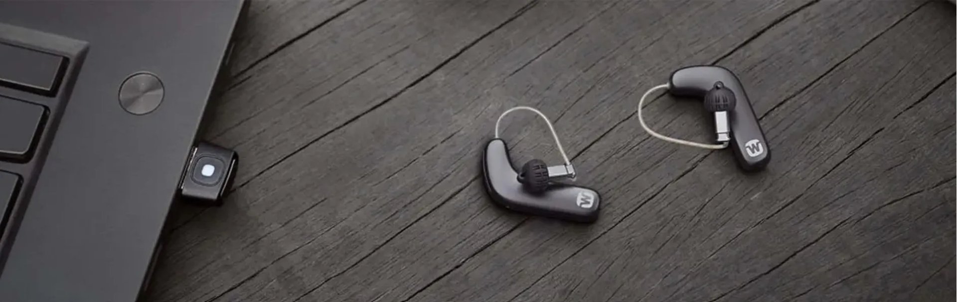 widex hearing aids on a desk
