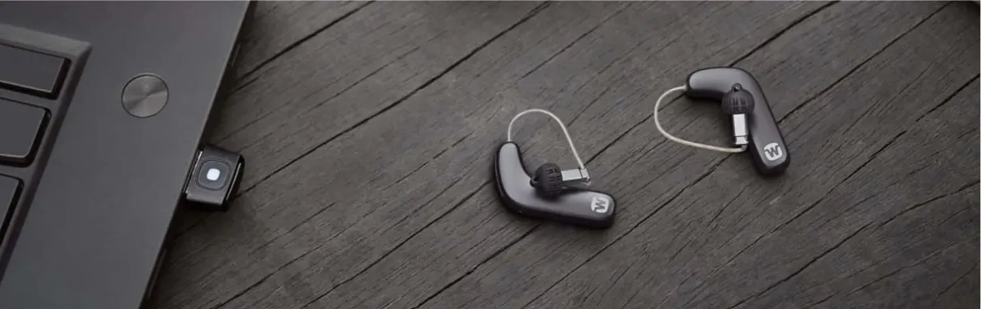 widex hearing aids on a desk