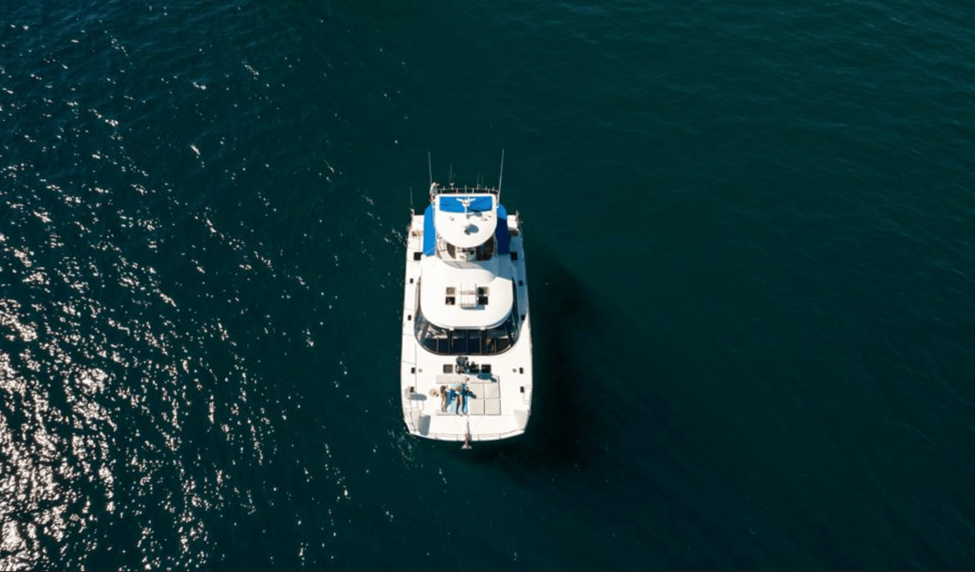 aerial photography of white yacht on calm waters