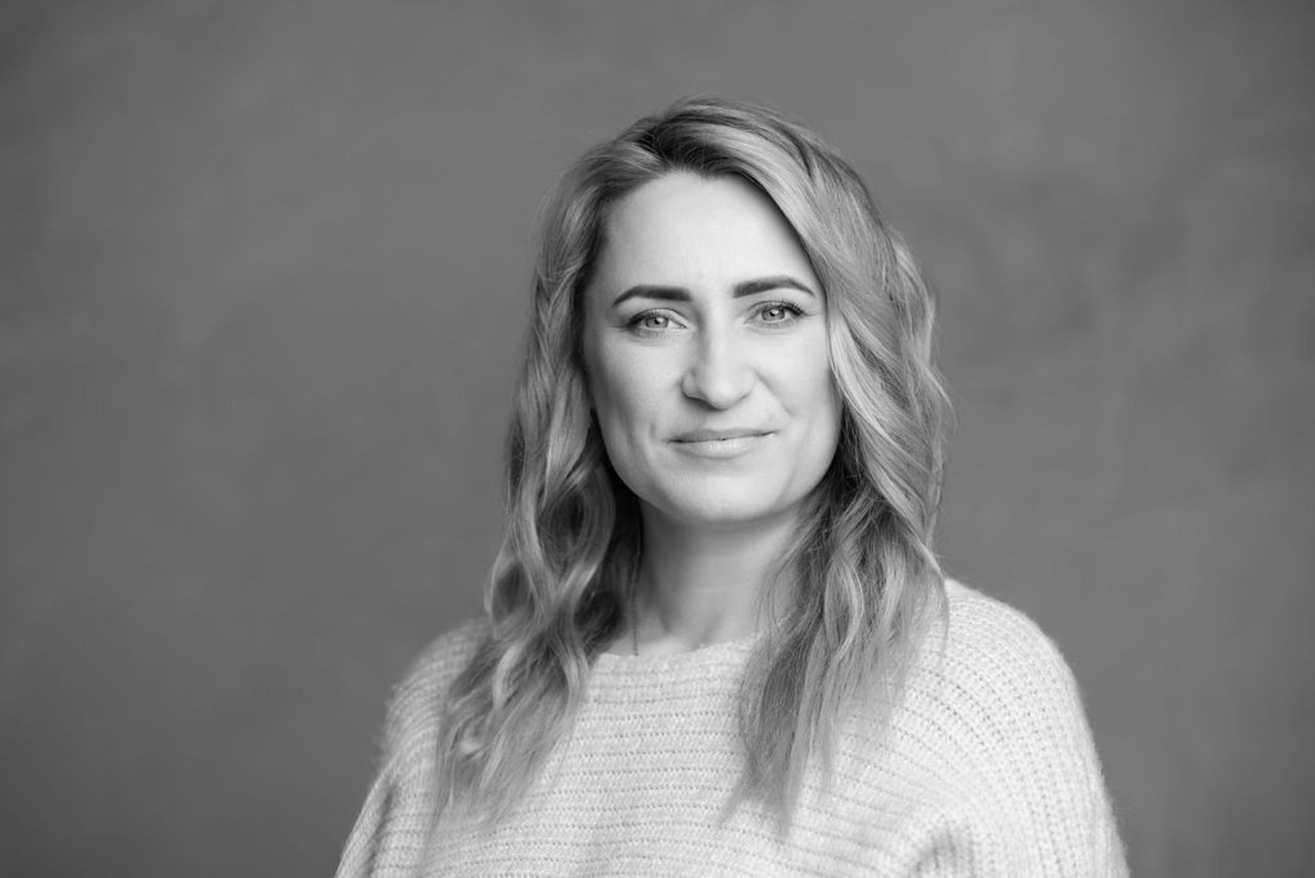 an abstract photo of a curved building with a blue sky in the background