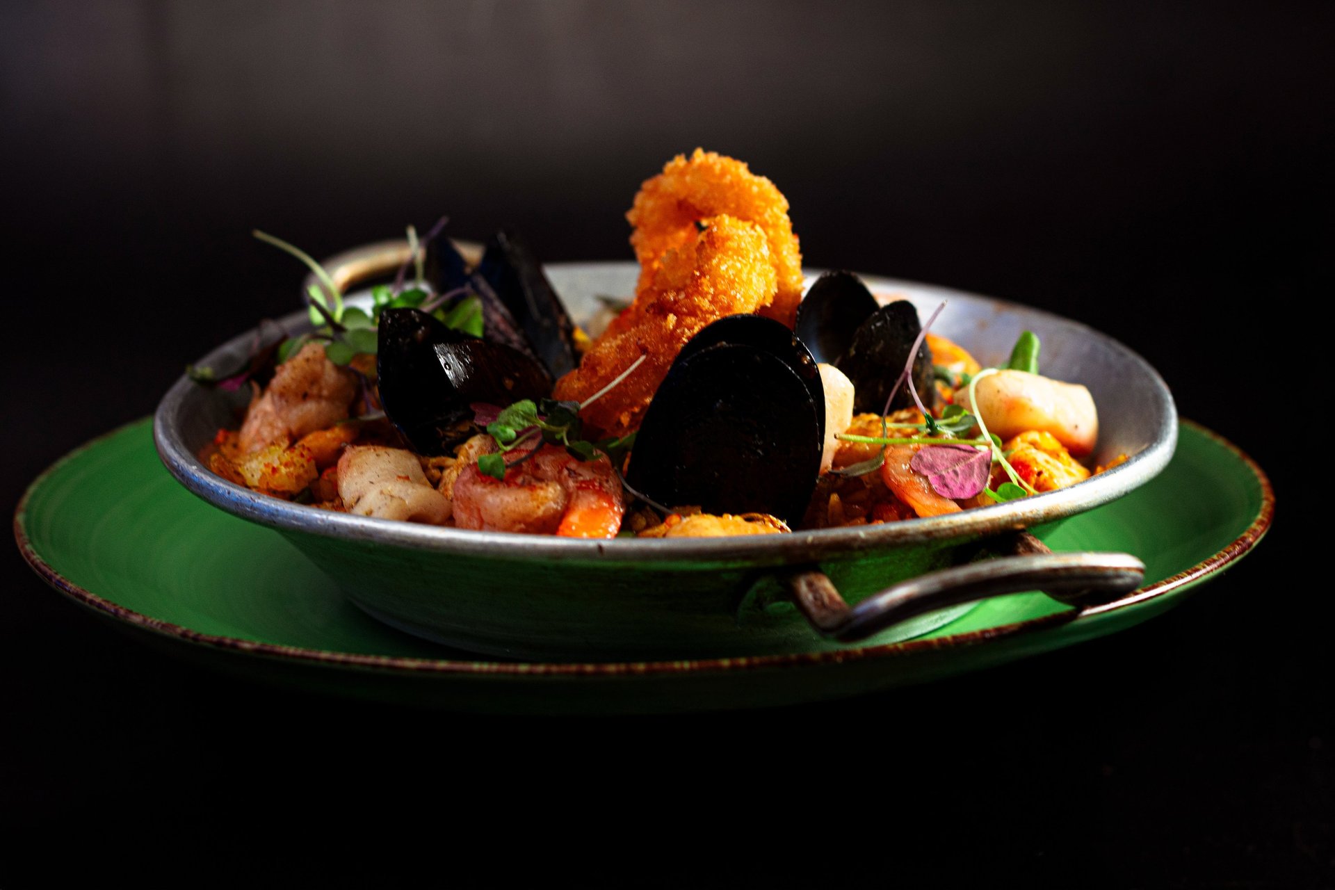 an abstract photo of a curved building with a blue sky in the background