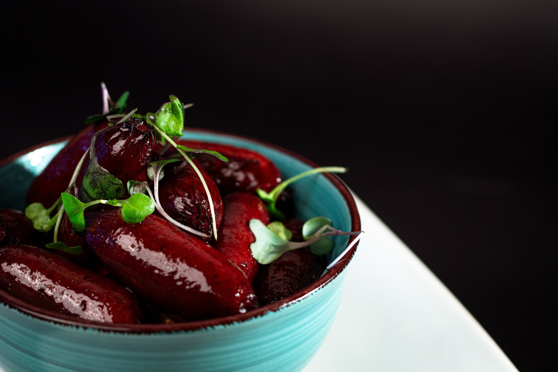 an abstract photo of a curved building with a blue sky in the background