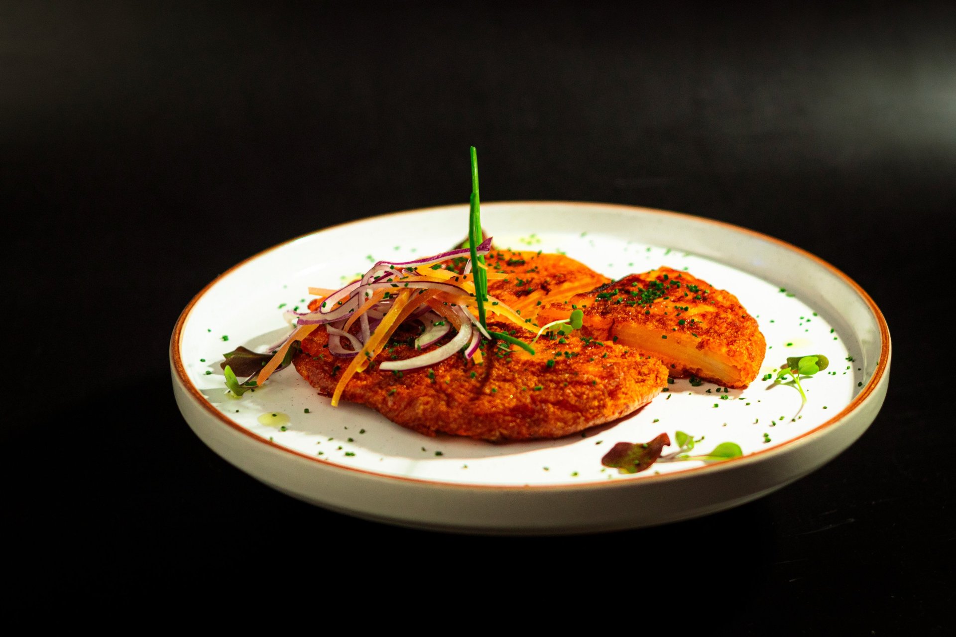 an abstract photo of a curved building with a blue sky in the background