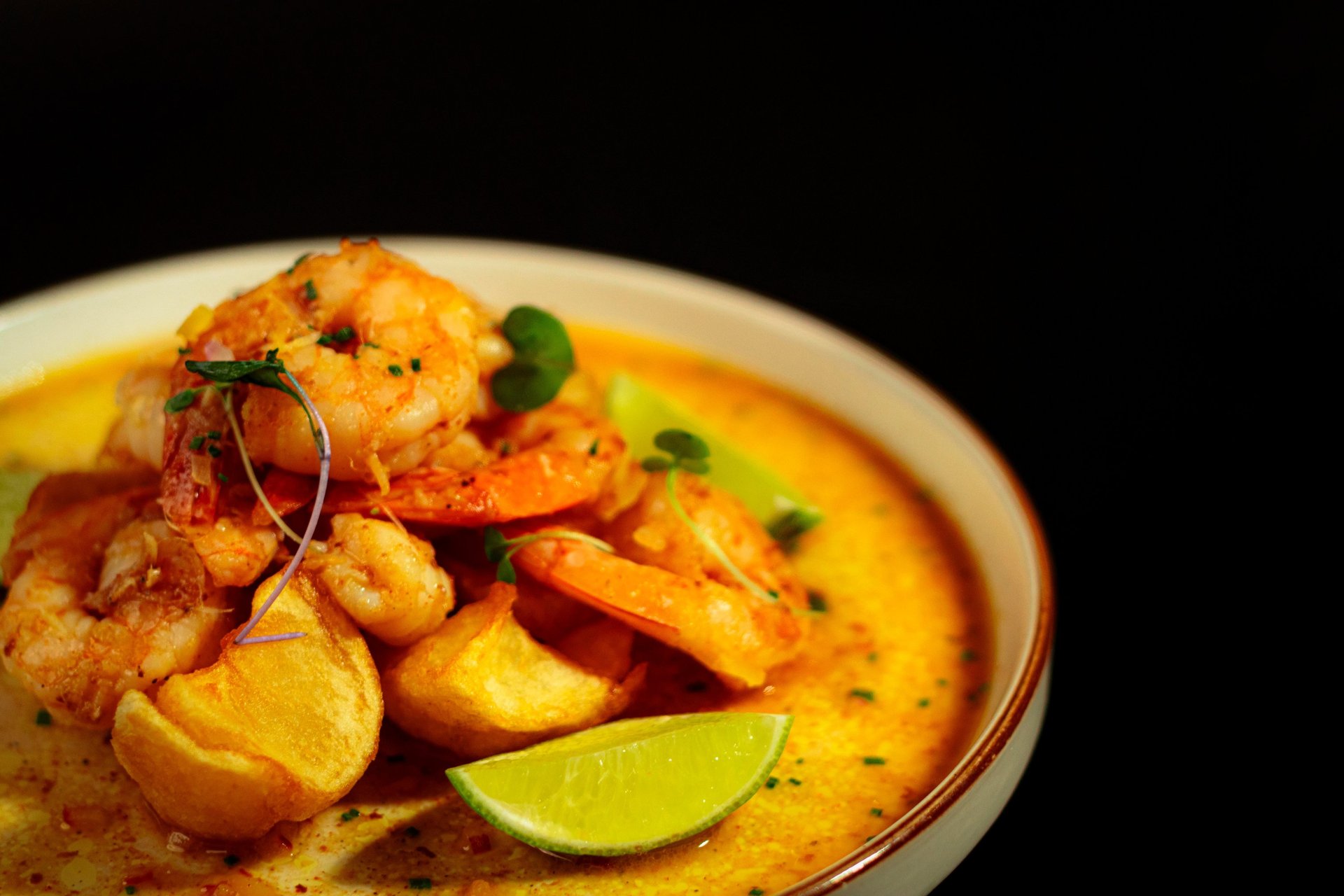 an abstract photo of a curved building with a blue sky in the background