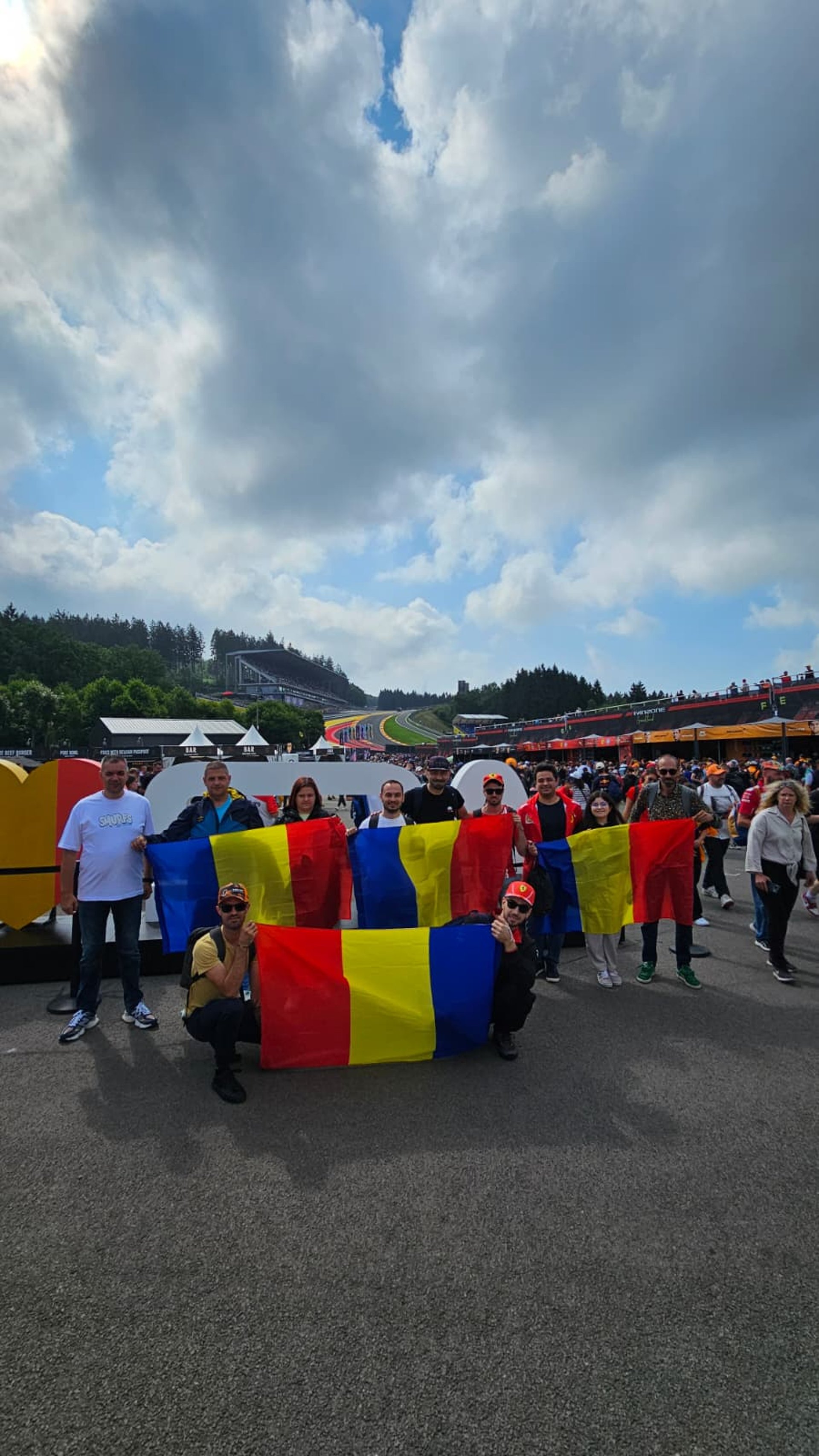 woman wearing yellow long-sleeved dress under white clouds and blue sky during daytime