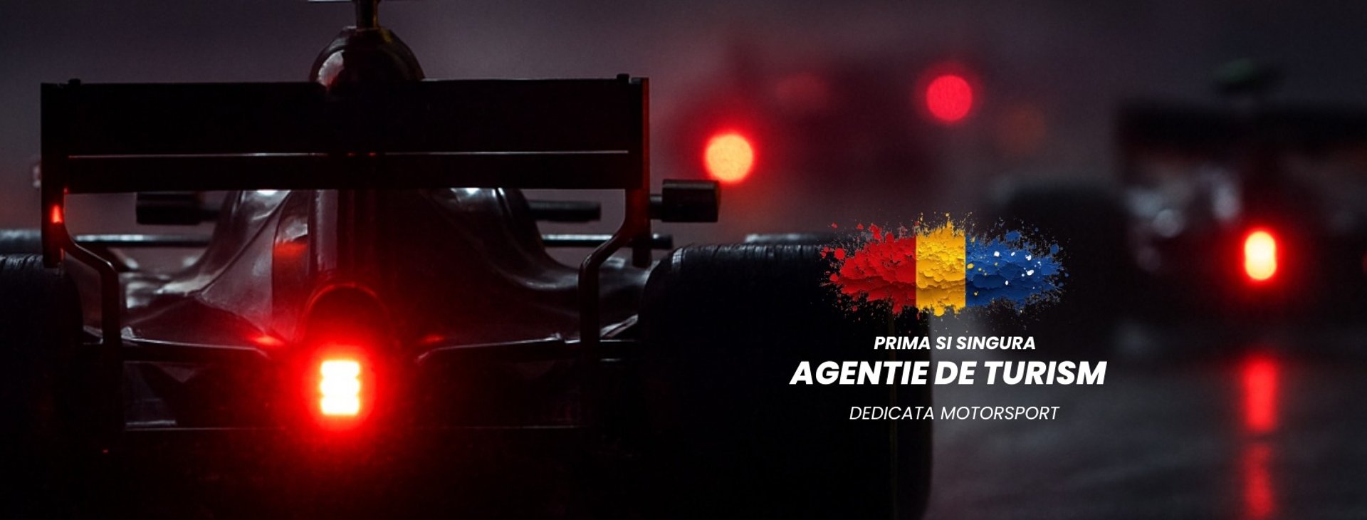 A race car is driving on the track.