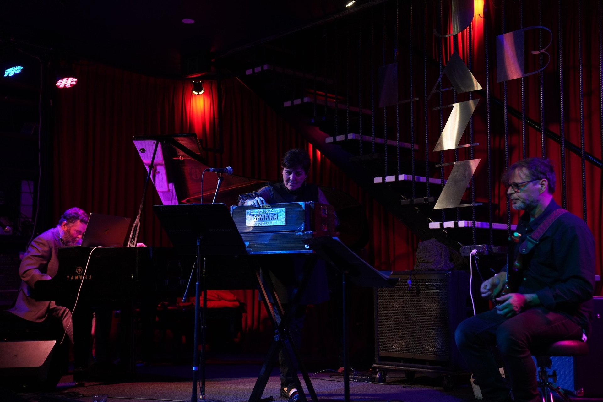 an abstract photo of a curved building with a blue sky in the background