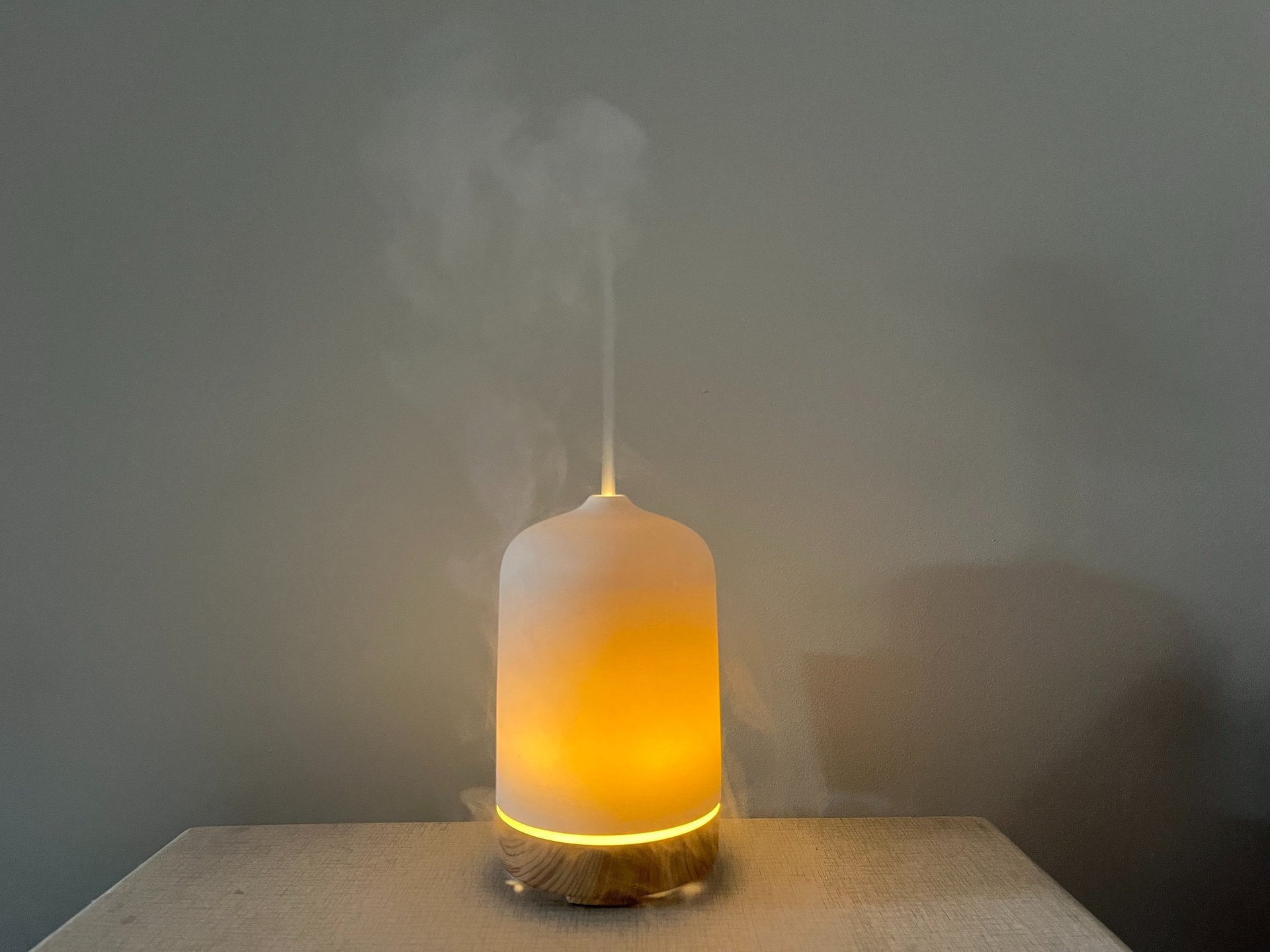 Diffuser giving off steam on a table