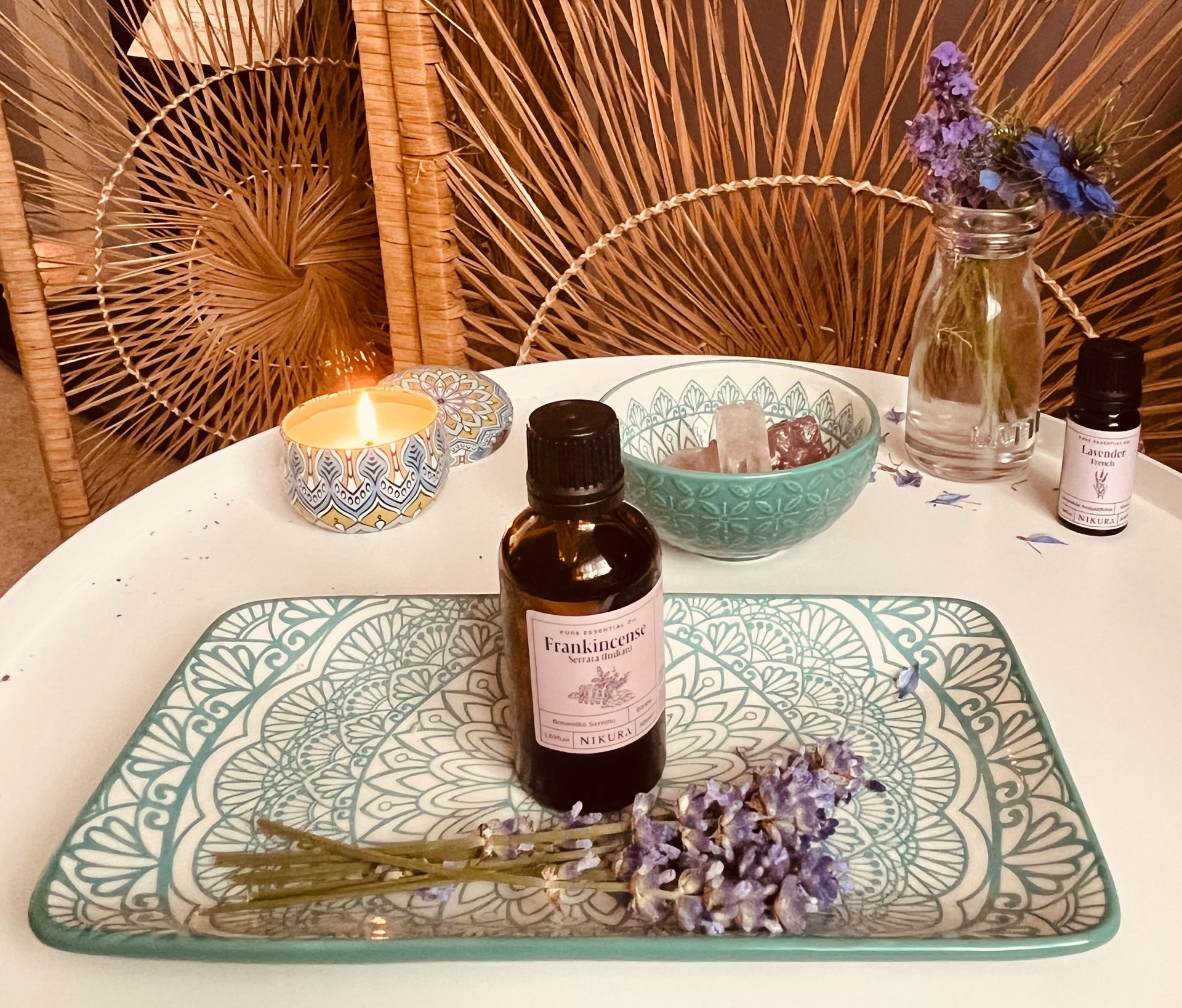 Incense, essential oils and flowers on a table
