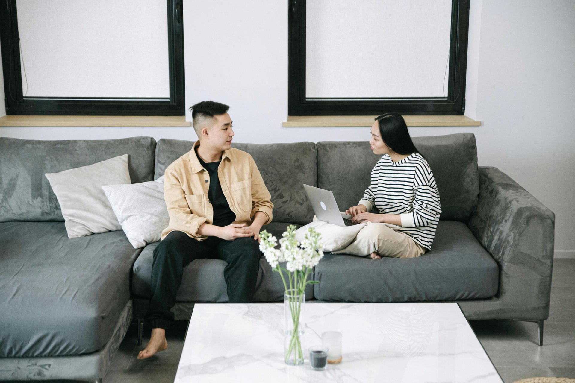 an abstract photo of a curved building with a blue sky in the background