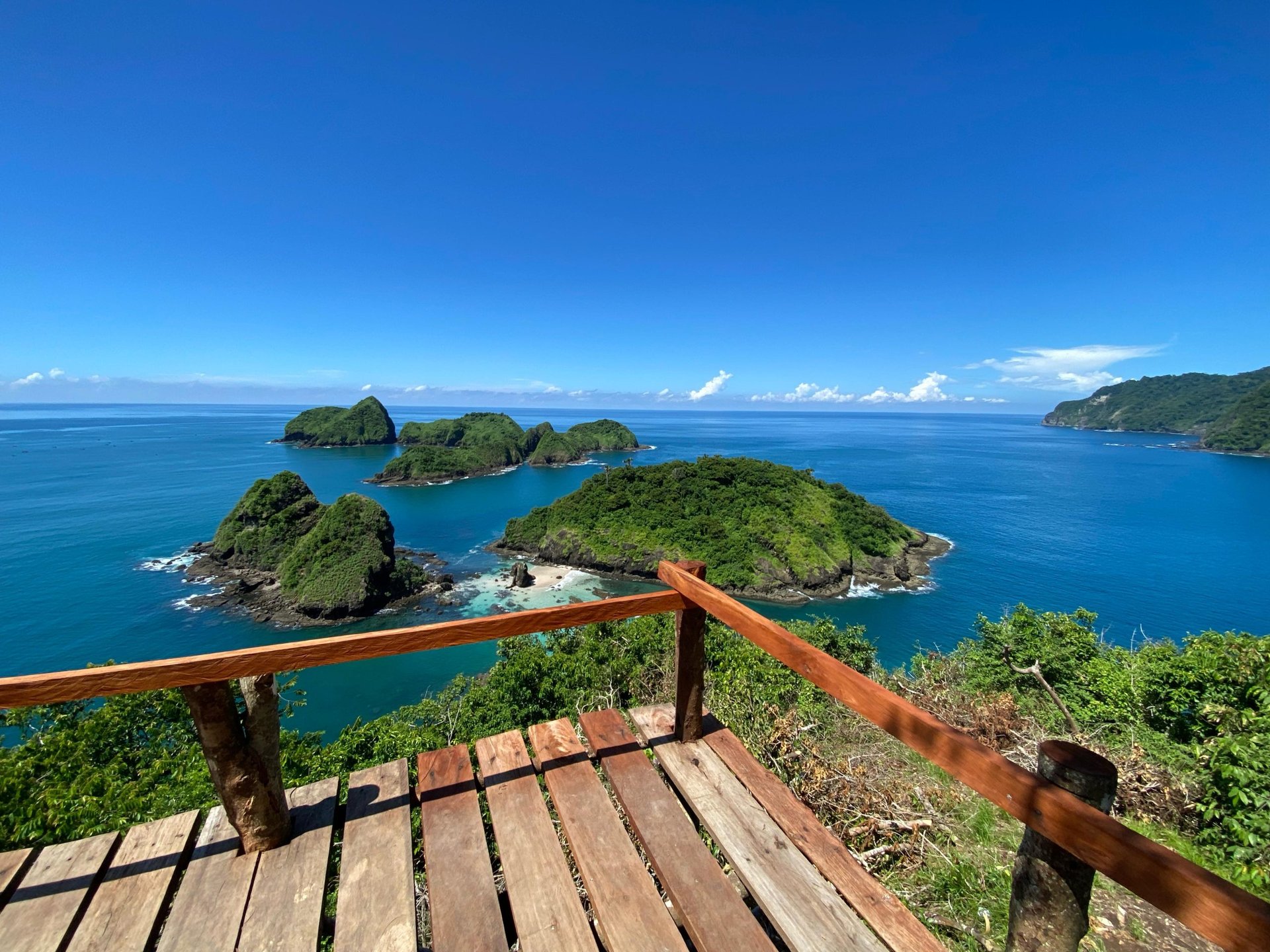 a harbor filled with lots of boats under a blue sky