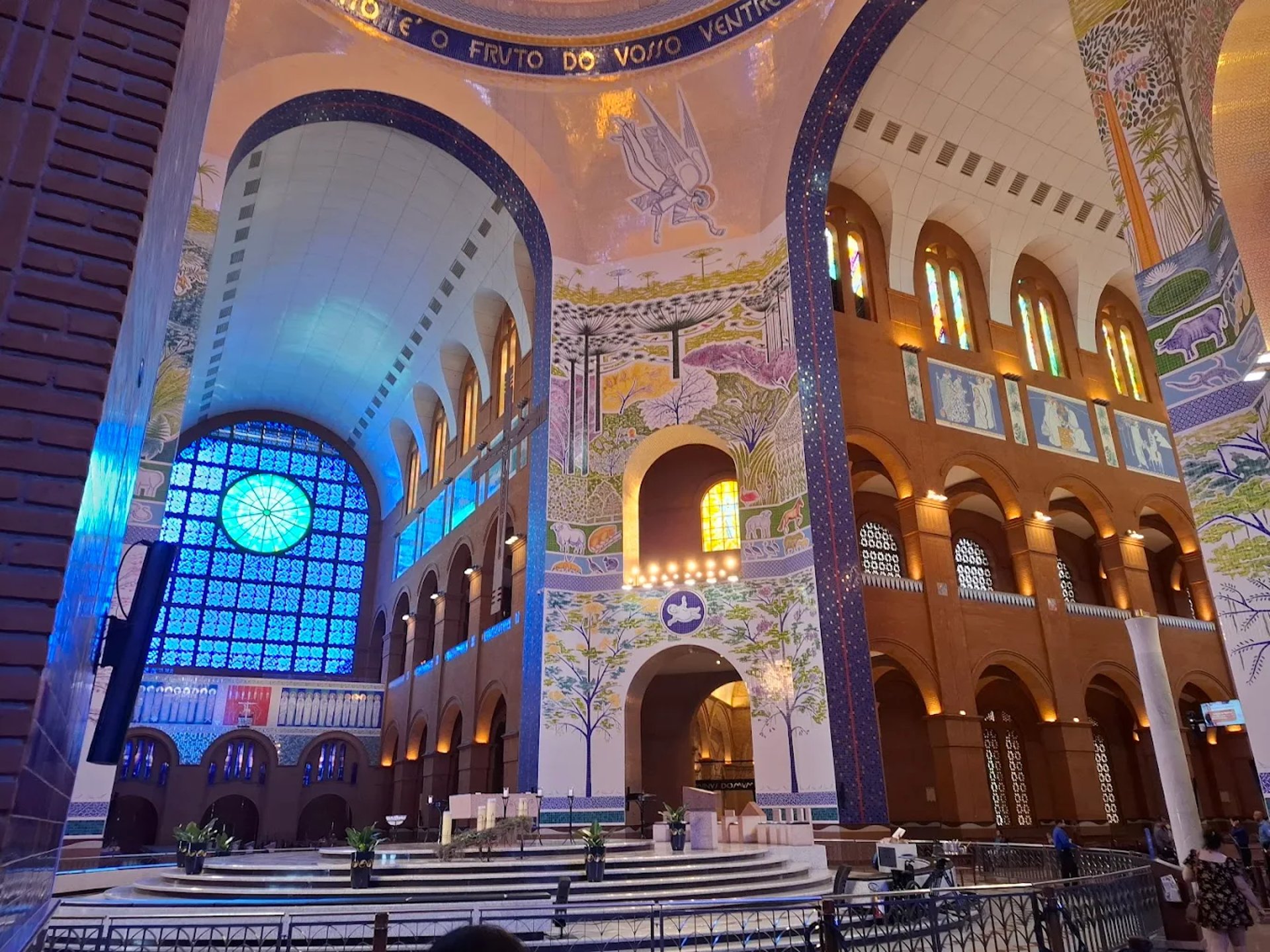 an abstract photo of a curved building with a blue sky in the background